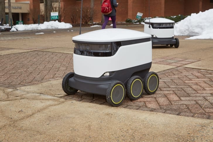 Food delivery robot outdoors.