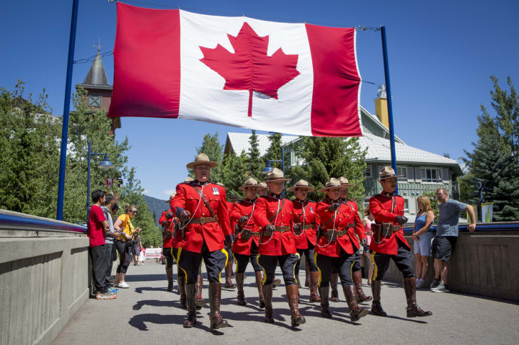 Officers of the Royal Canadian Mounted Police marching in a Canada Day parade