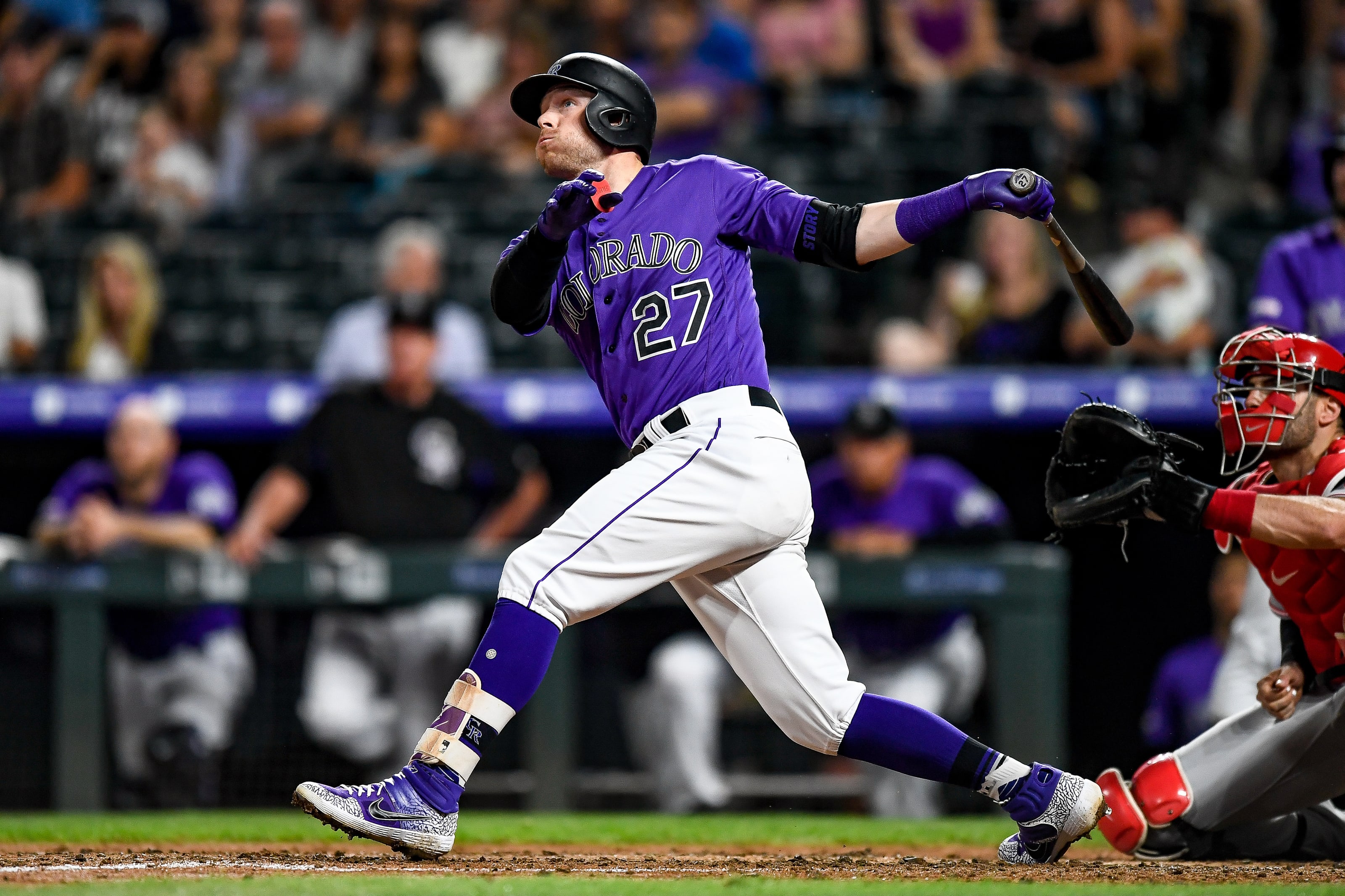 Trevor Story #27 of the Colorado Rockies hits a fifth inning leadoff homer against the Cincinnati Reds.