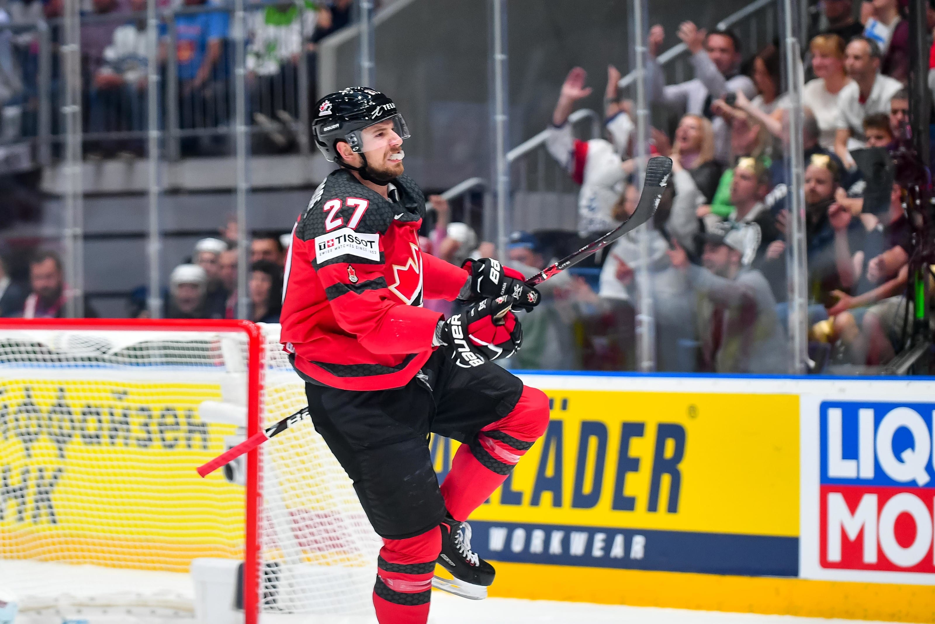 Canada's Shea Theodore (27) celebrates after scoring a goal against Finland  goaltender Kevin Lankinen (30) during the Ice Hockey World Championships  gold medal match at the Ondrej Nepela Arena in Bratislava, Slovakia