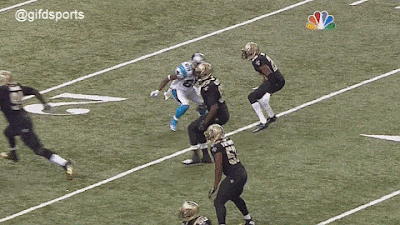 Panthers WR Steve Smith throwns down Saints defender (GIF)