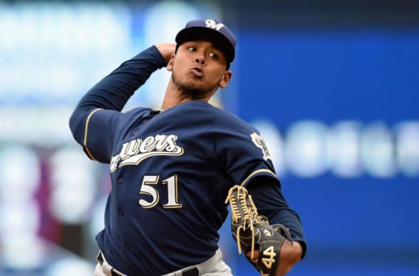 Milwaukee Brewers' Freddy Peralta walks to the dugout during the