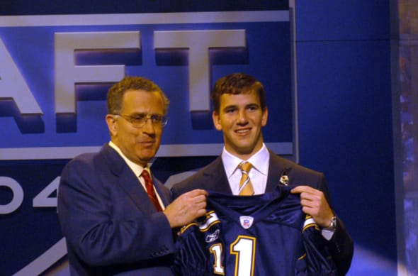 eli manning holding chargers jersey