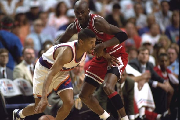The Phoenix Suns' Kevin Johnson gets blocked by the Chicago Bulls