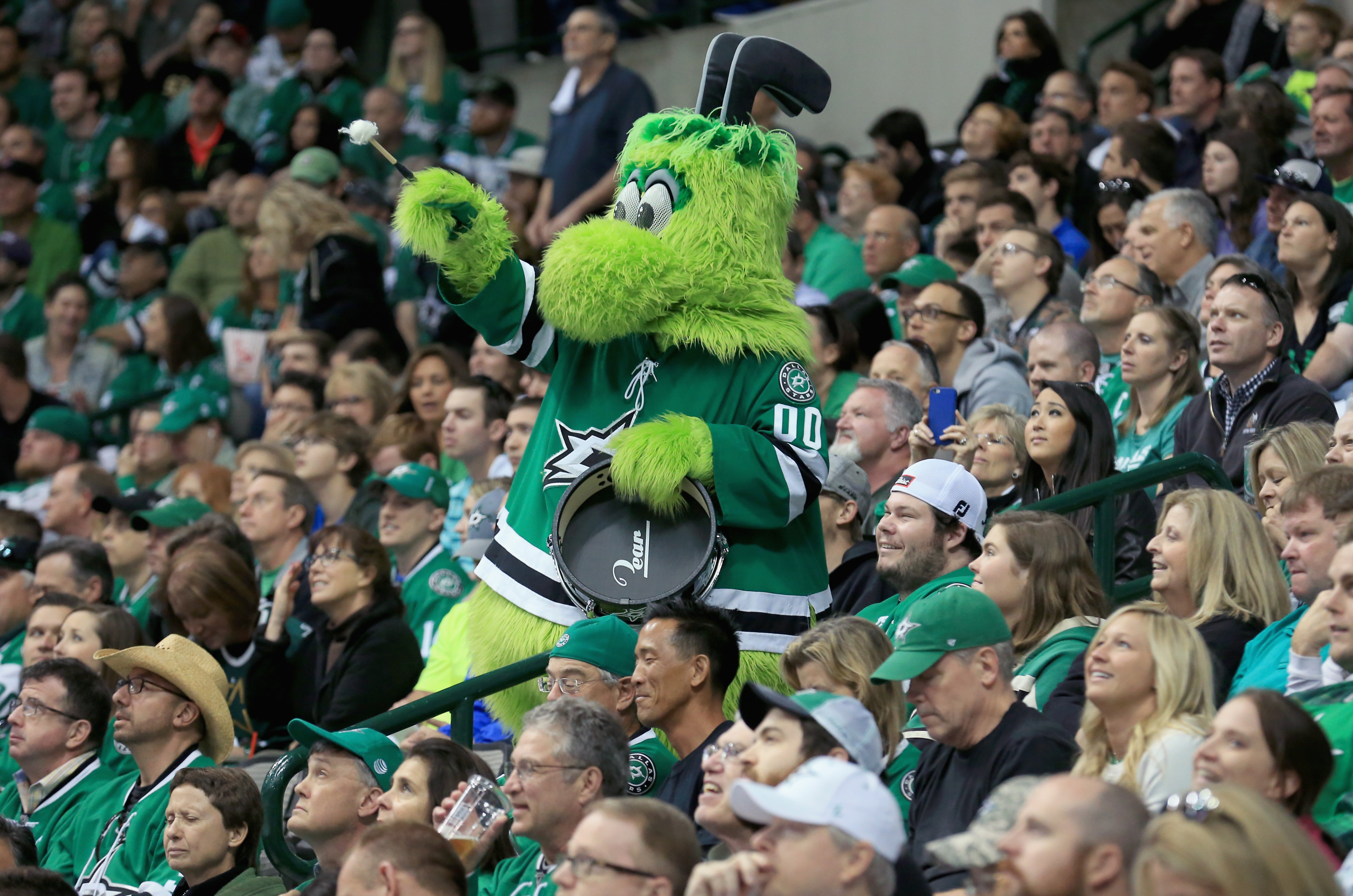 Dallas Stars mascot Victor E. Green rallies fans during the second period  of a preseason NHL hockey game against the St. Louis Blues, Tuesday, Sept.  18, 2018, in Dallas. Dallas won 5-3. (