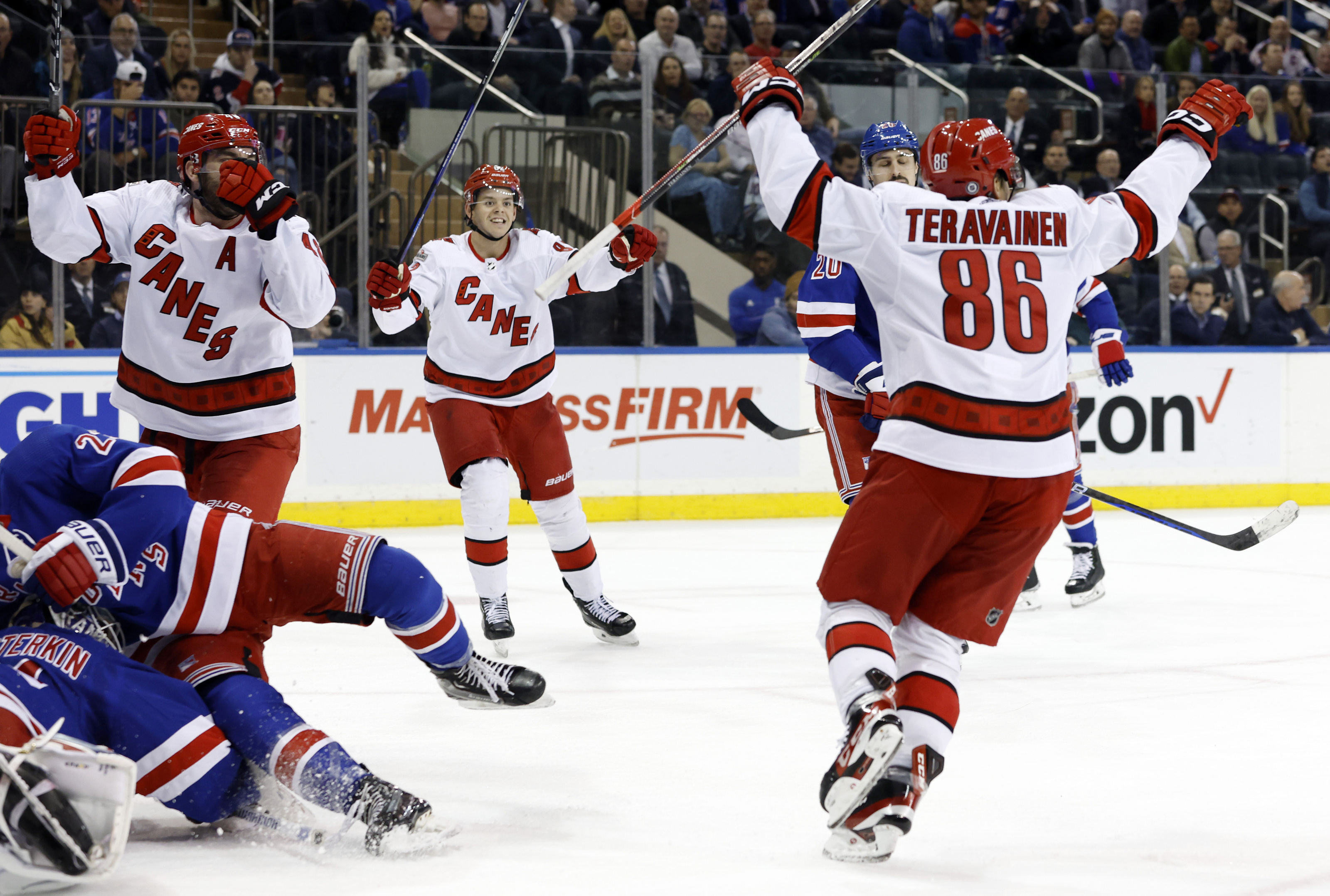 Rangers score 3 in 3rd to stop Hurricanes' win streak at 11 - The