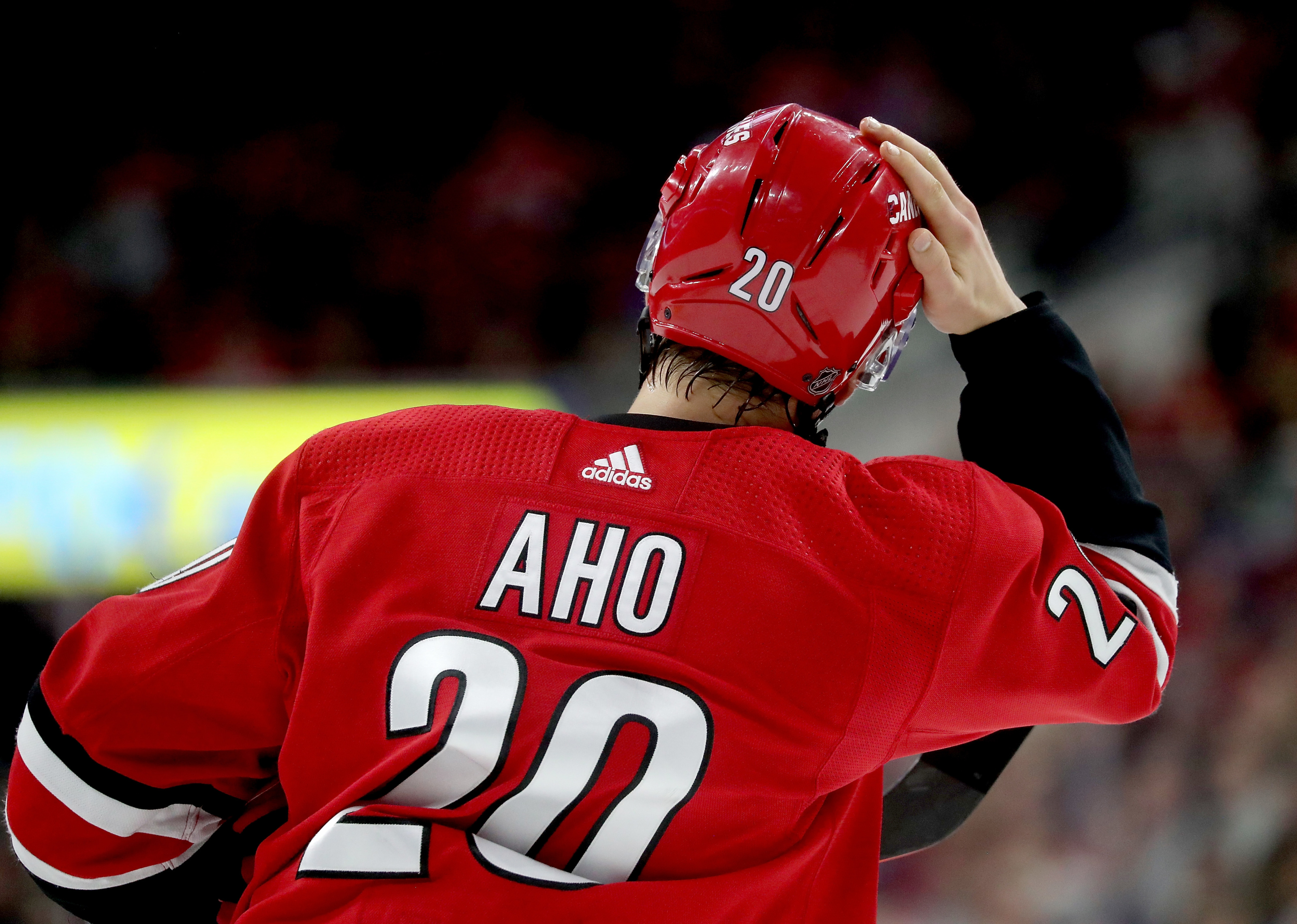 Carolina Hurricanes' Sebastian Aho (20) waits for a face-off during the  third period of an NHL hockey game against the Detroit Red Wings, Saturday,  Nov. 10, 2018, in Raleigh, N.C. (AP Photo/Karl