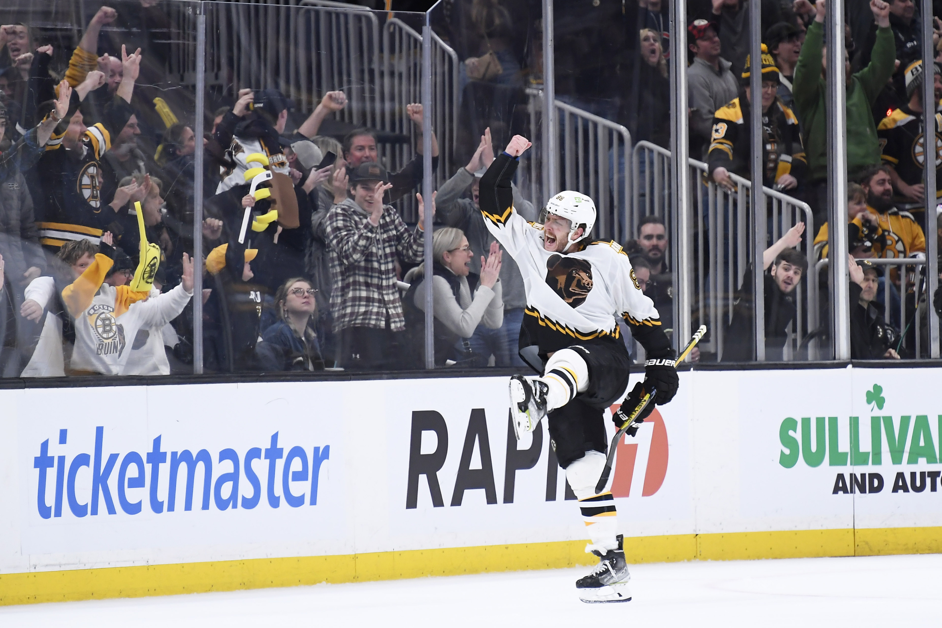 Hampus Lindholm of the Boston Bruins tosses his glove to a fan as he  News Photo - Getty Images