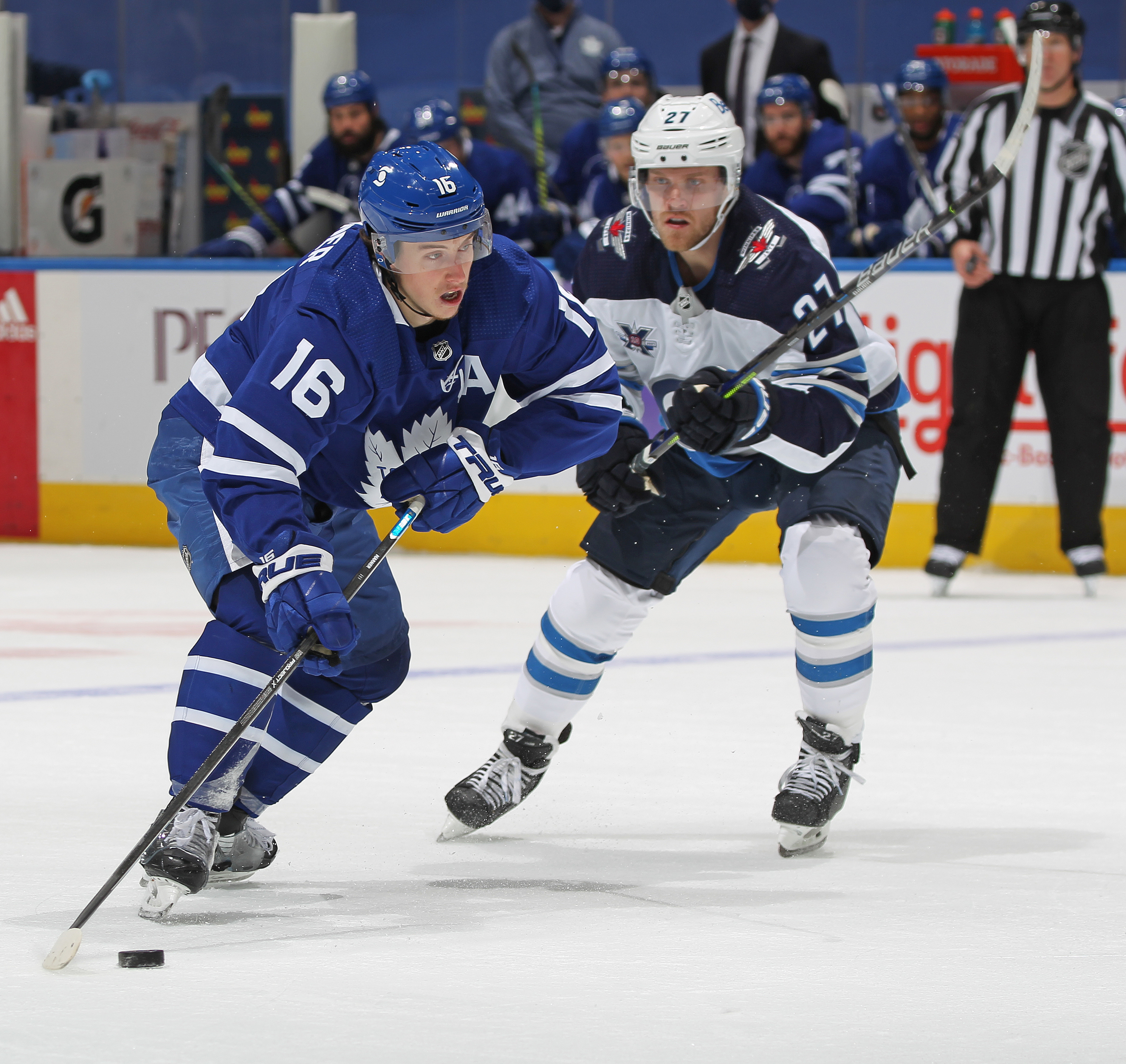Toronto Maple Leafs forward Mitch Marner, eft, shoots as Maple
