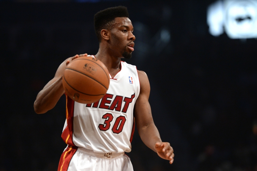 Norris Cole dribbles the ball between his legs