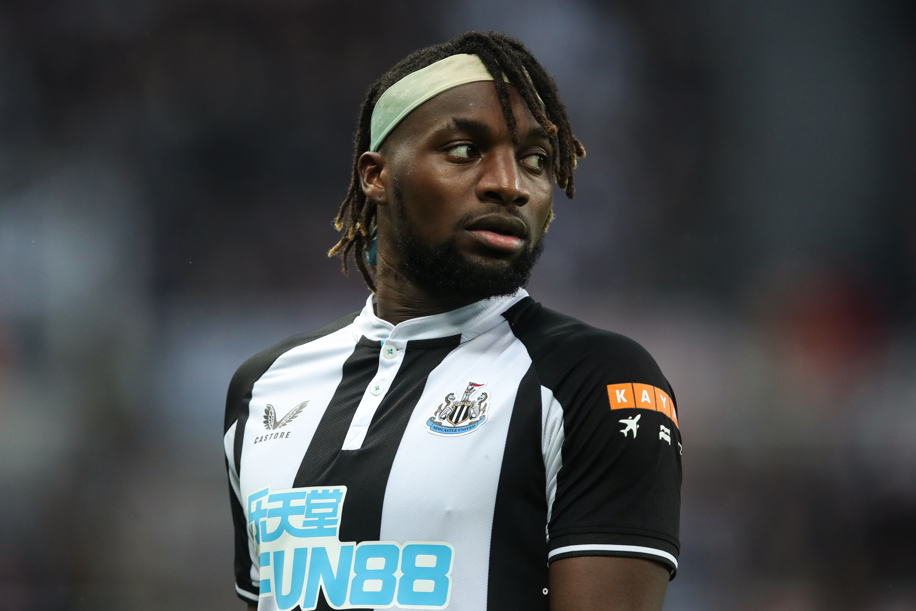 Allan Saint-Maximin of Newcastle United wearing a gold and black