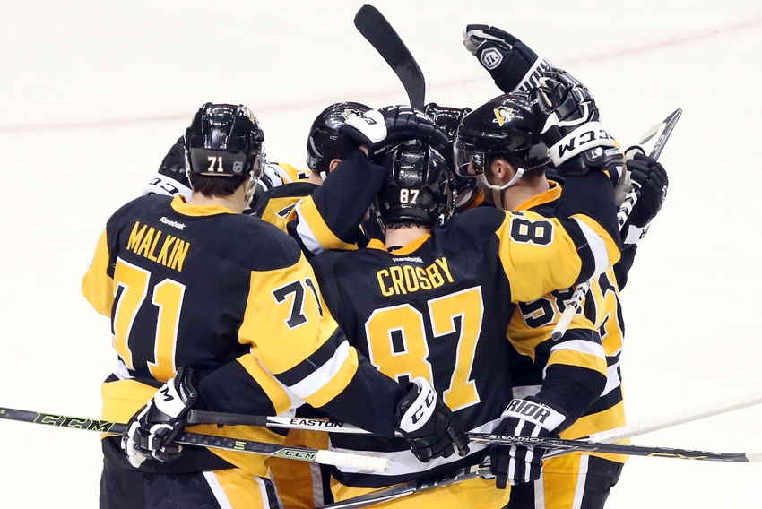 Pittsburgh Penguins center Sidney Crosby (87) points to his