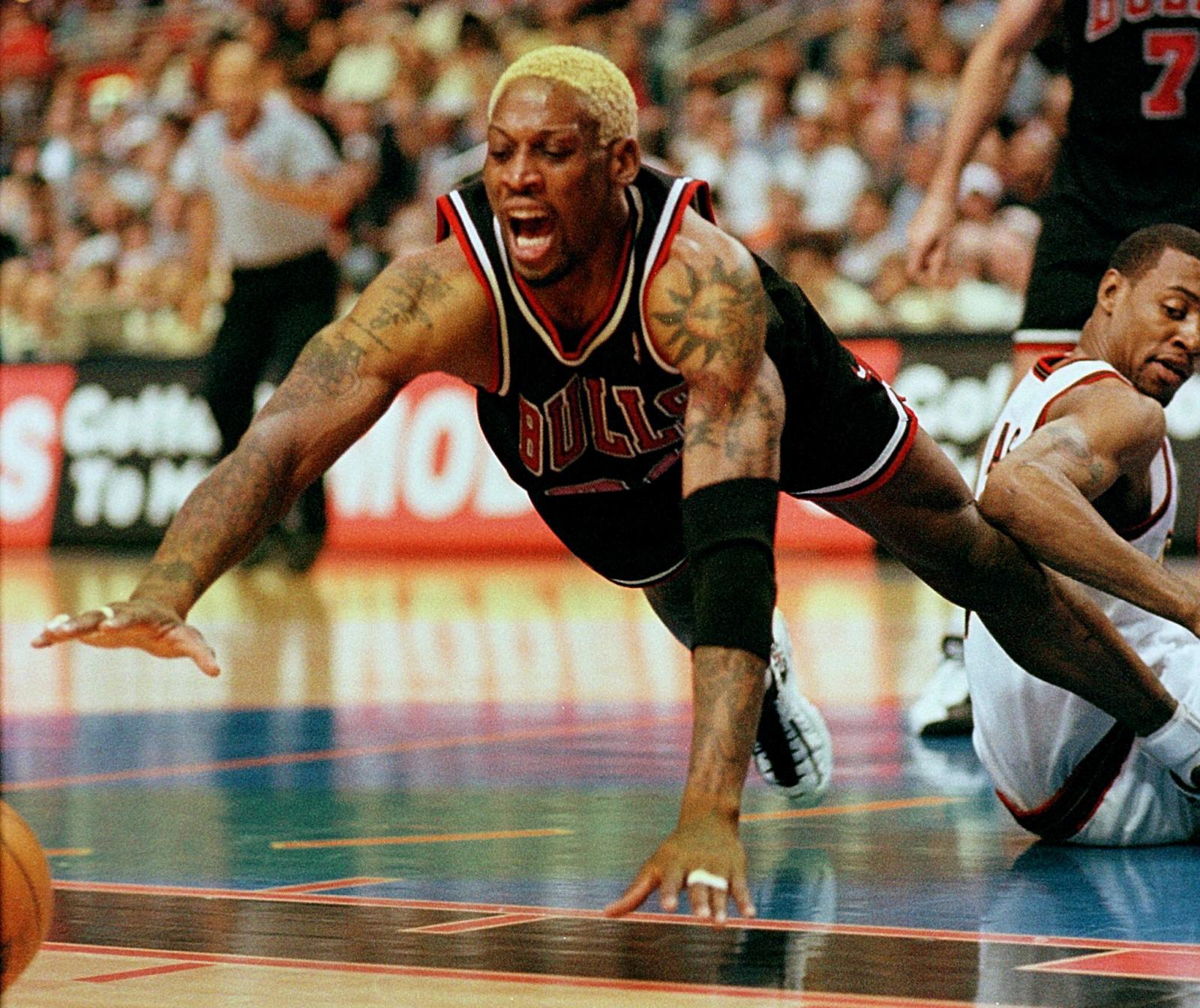 Dennis Rodman of the Los Angeles Lakers reacts to a play during a