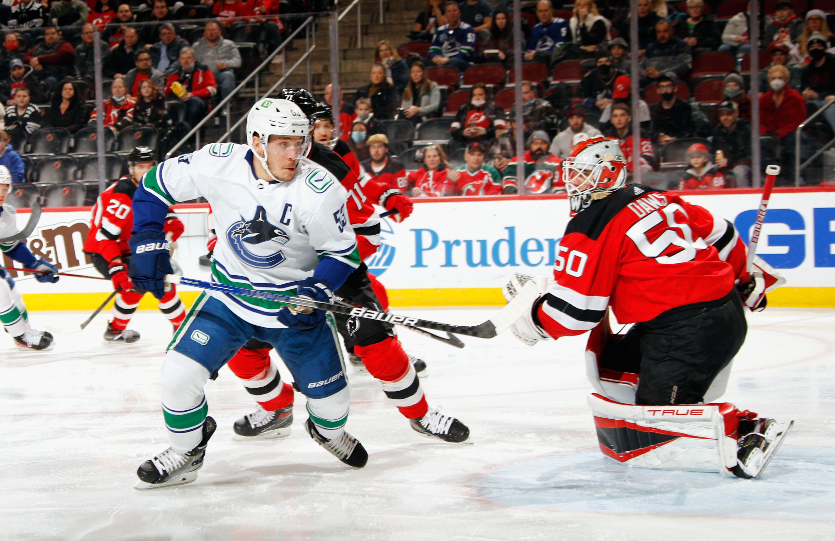 Devils fight back to beat Canucks in shootout 