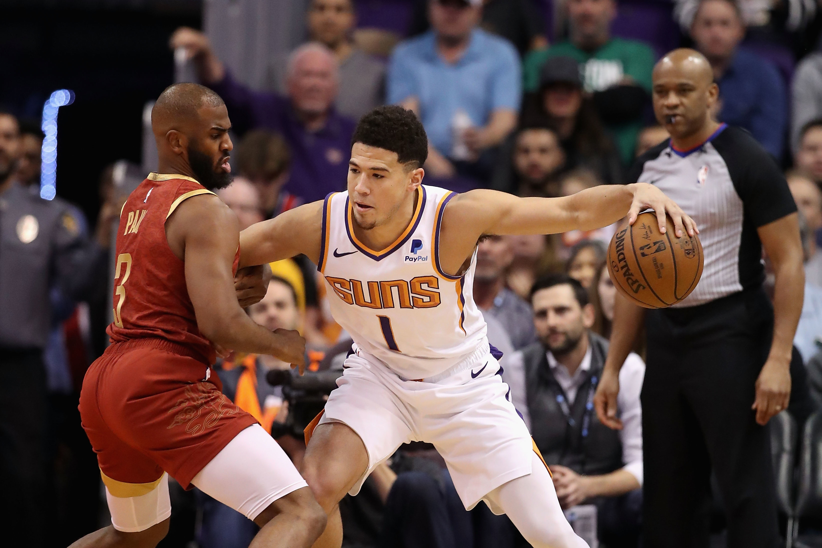 Phoenix Suns' Chris Paul (3) and Devin Booker waits for play to
