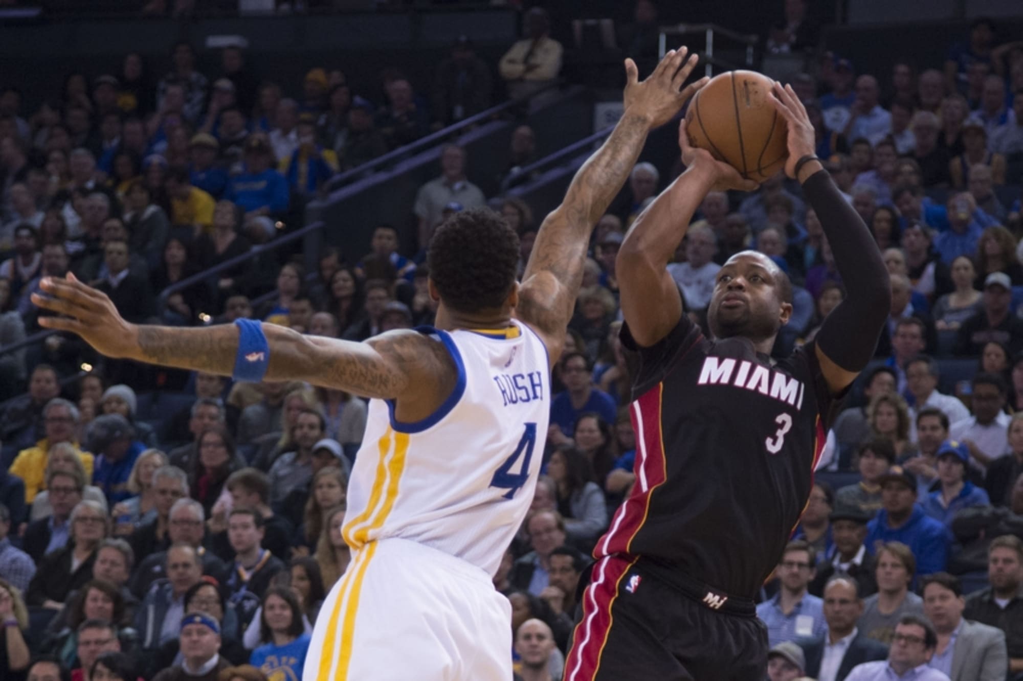 The Golden State Warriors' Brandon Rush (4), left, gets past the
