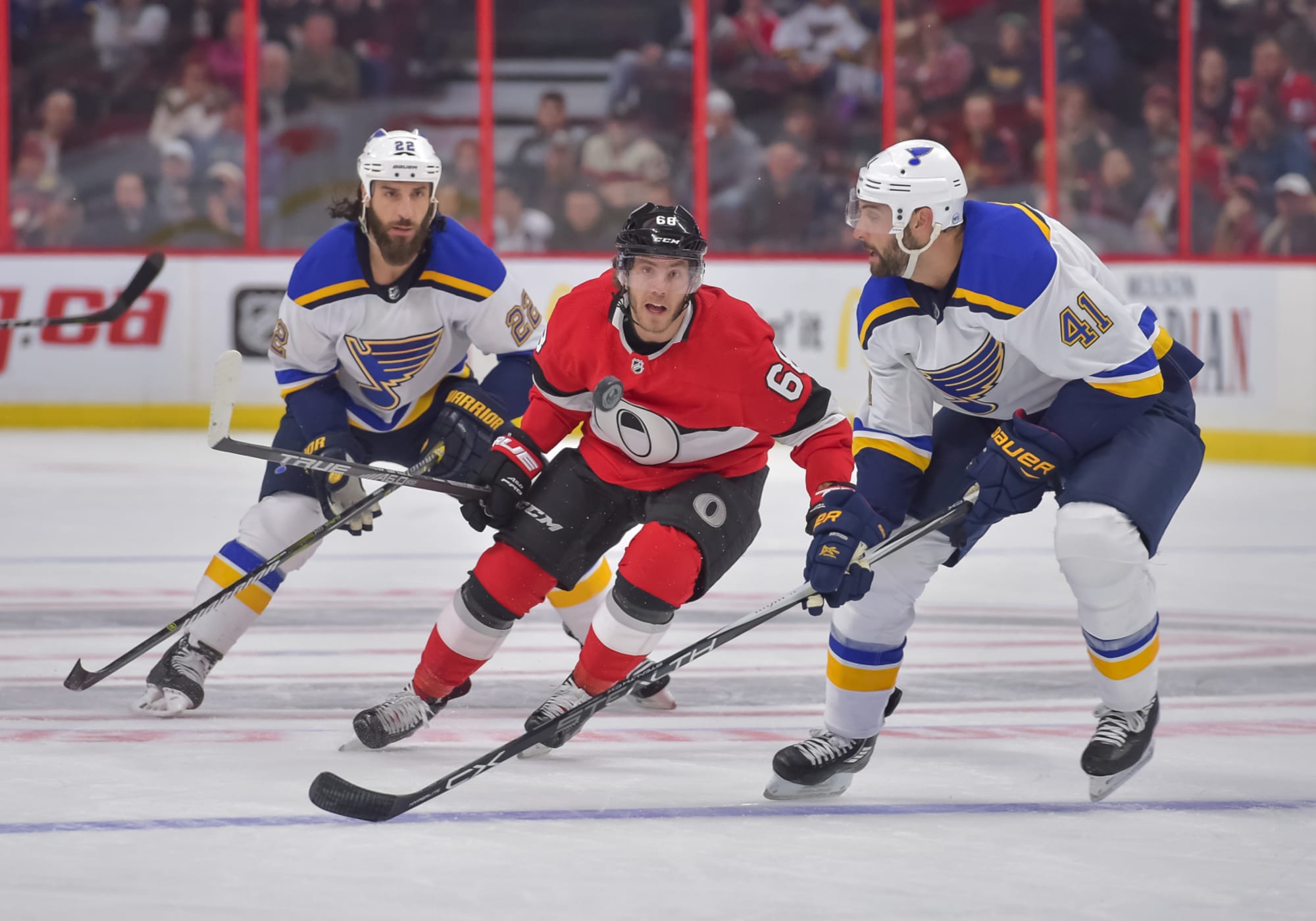 St. Louis Blues' Mike Hoffman (68) clears the puck from the melee