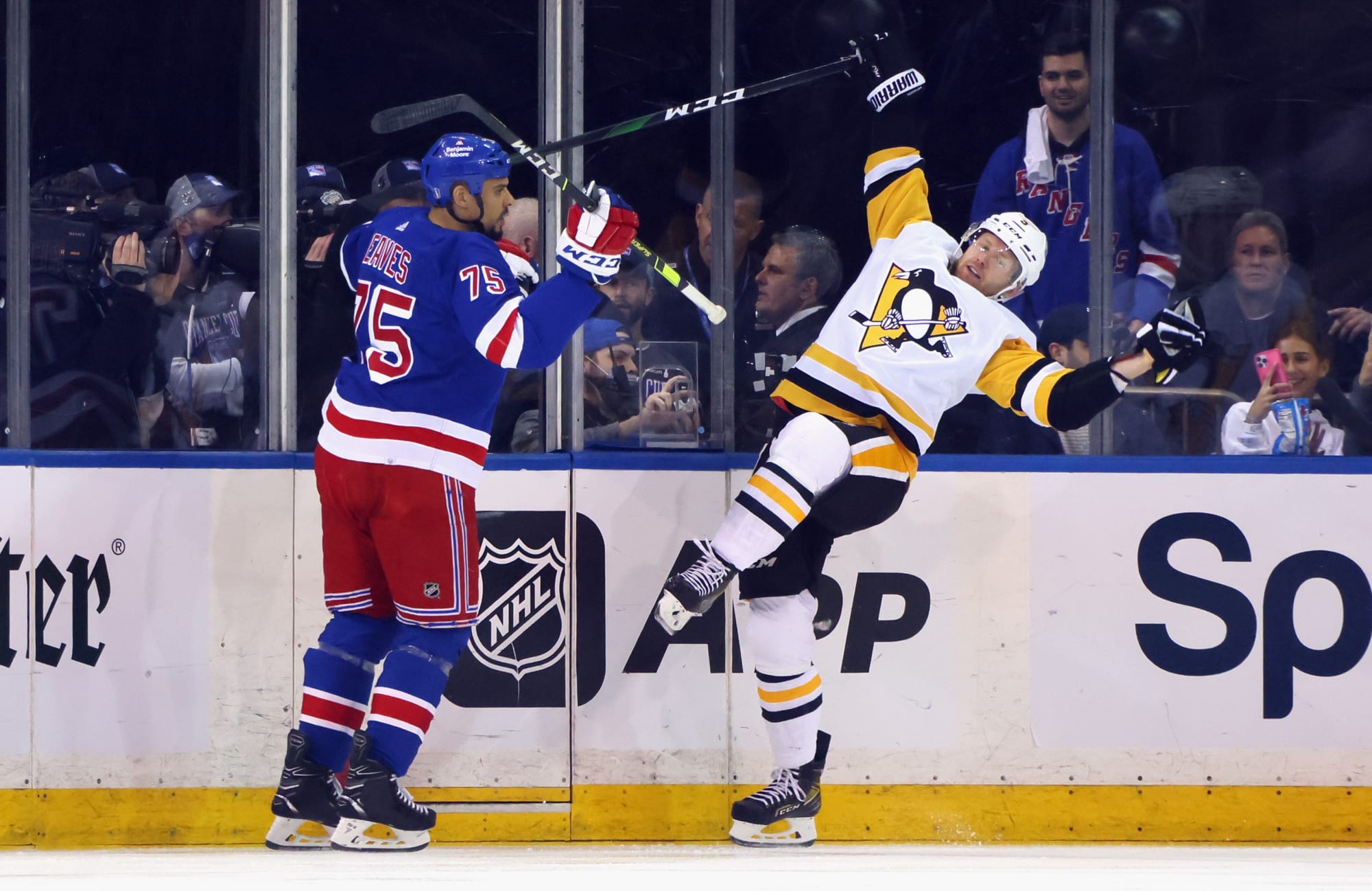Adam Lowry of the Winnipeg Jets and Ryan Reaves of the New York News  Photo - Getty Images
