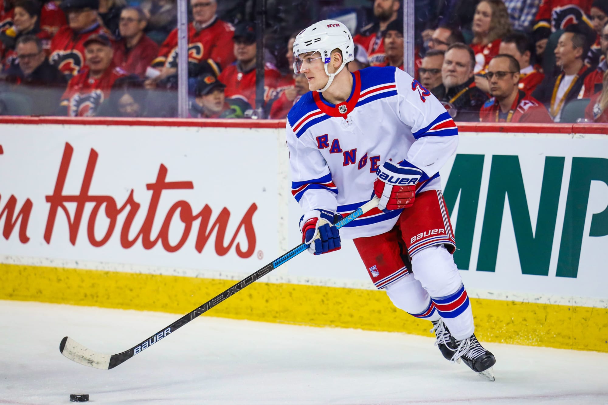 Download Dynamic Adam Fox in Action with the New York Rangers Wallpaper