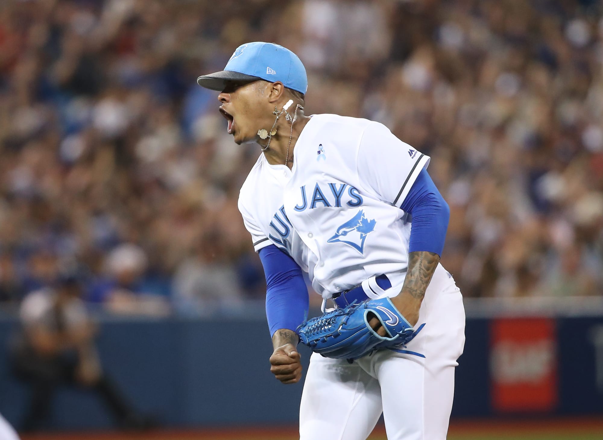 Blue Jays pitcher Marcus Stroman charges umpire, restrained by