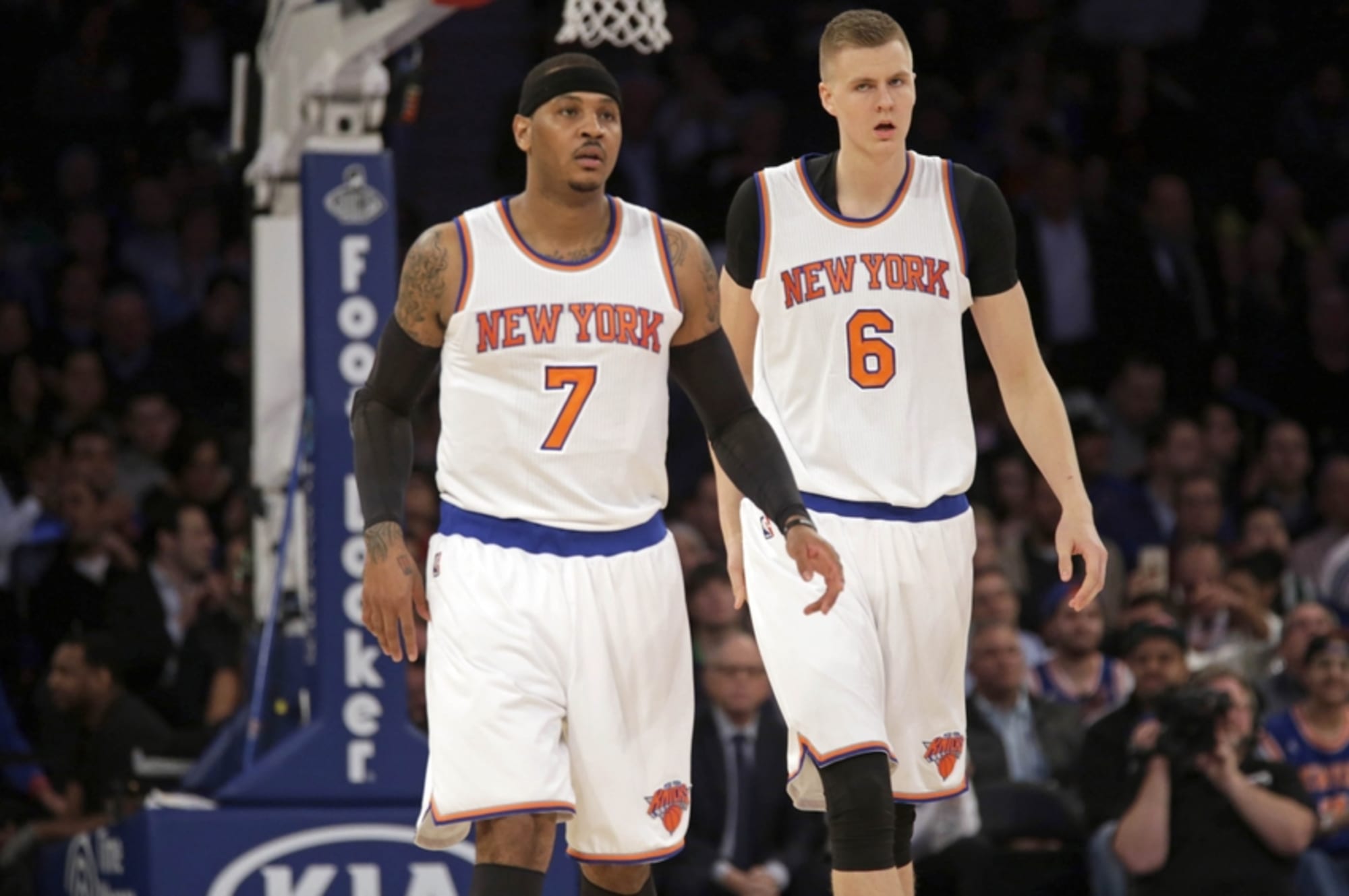 New York Knicks Kristaps Porzingis and Carmelo Anthony walk to the bench  when a the out is called in the second half against the Detroit Pistons at  Madison Square Garden in New