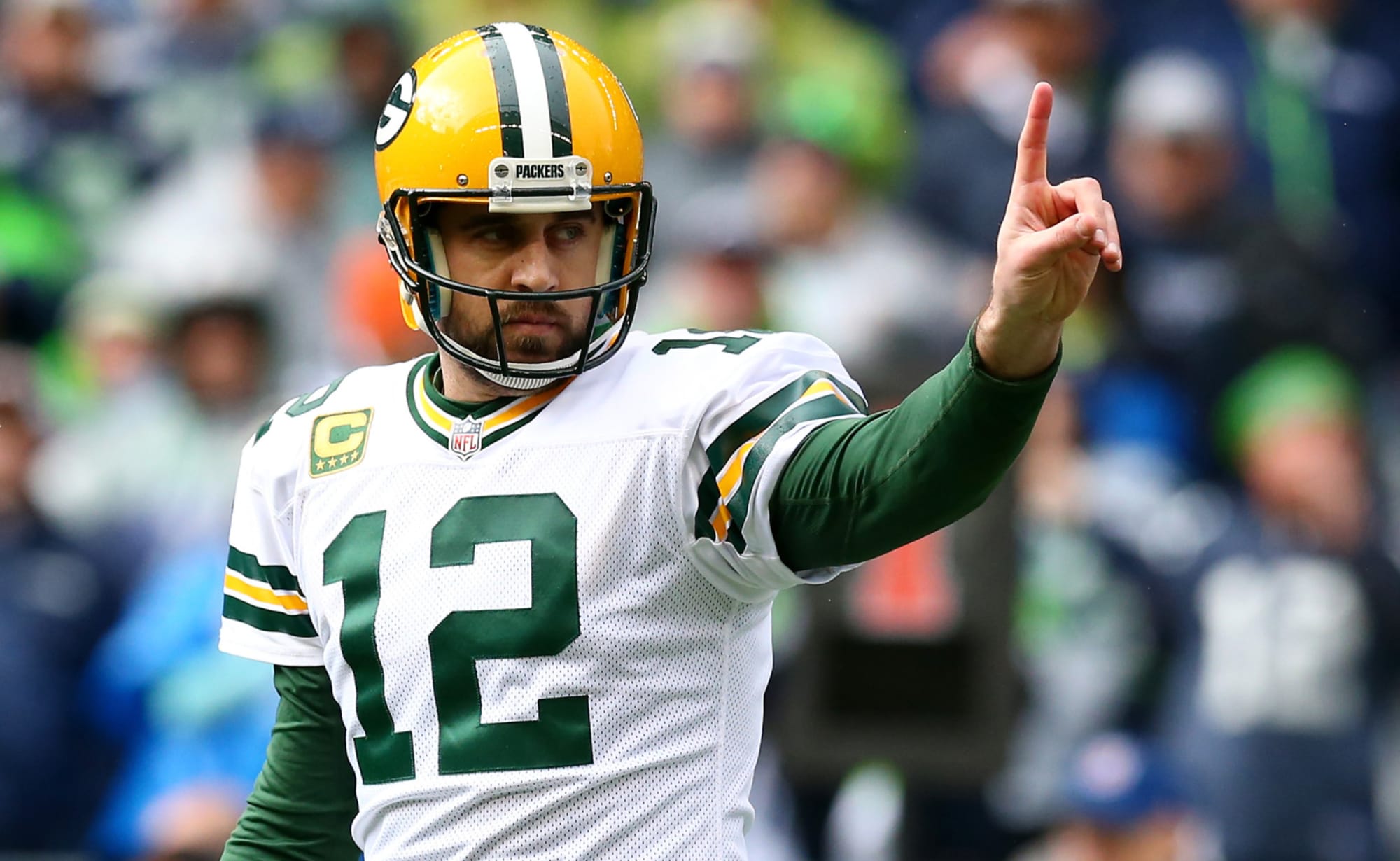 Green Bay Packers QB Aaron Rodgers, making gesture towards sideline