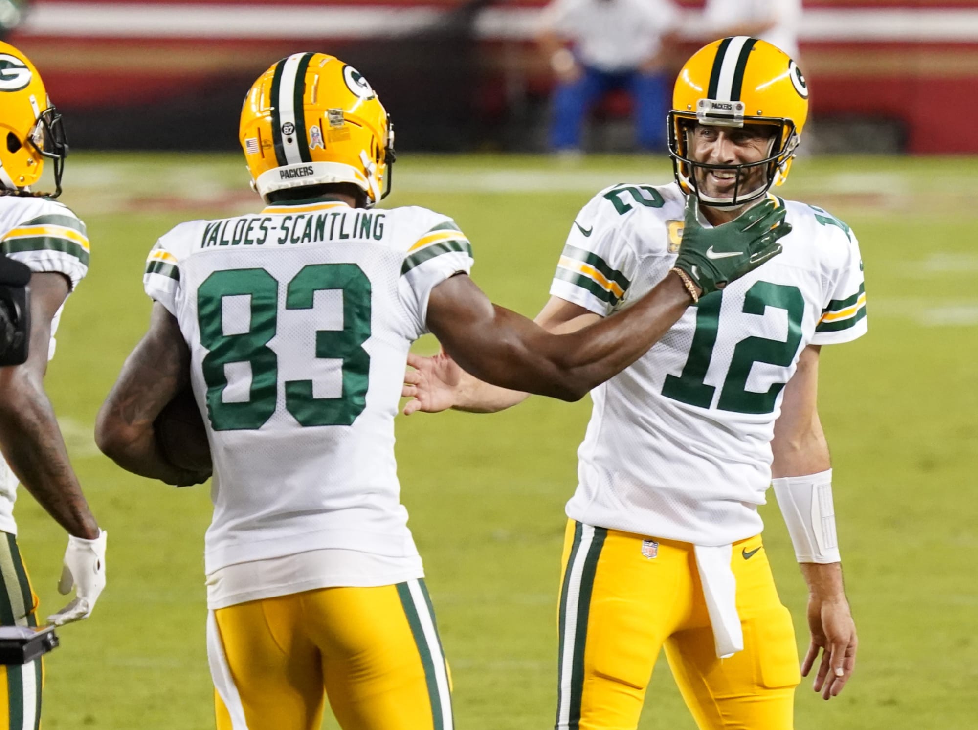 Marquez-Valdes Scantling and Aaron Rodgers high five after a big play.