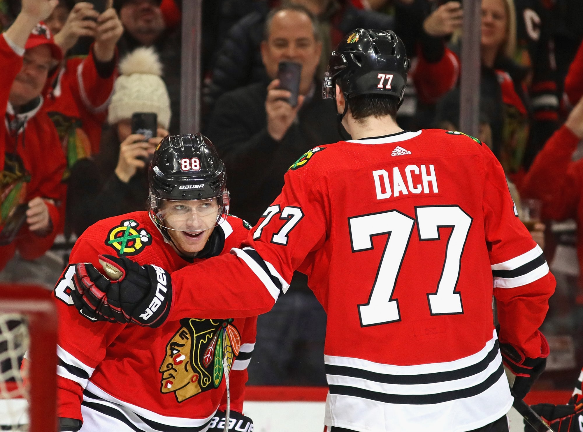 Chicago Blackhawks' Kirby Dach (77) and Patrick Kane (88) celebrate a goal  against the Vegas Go …