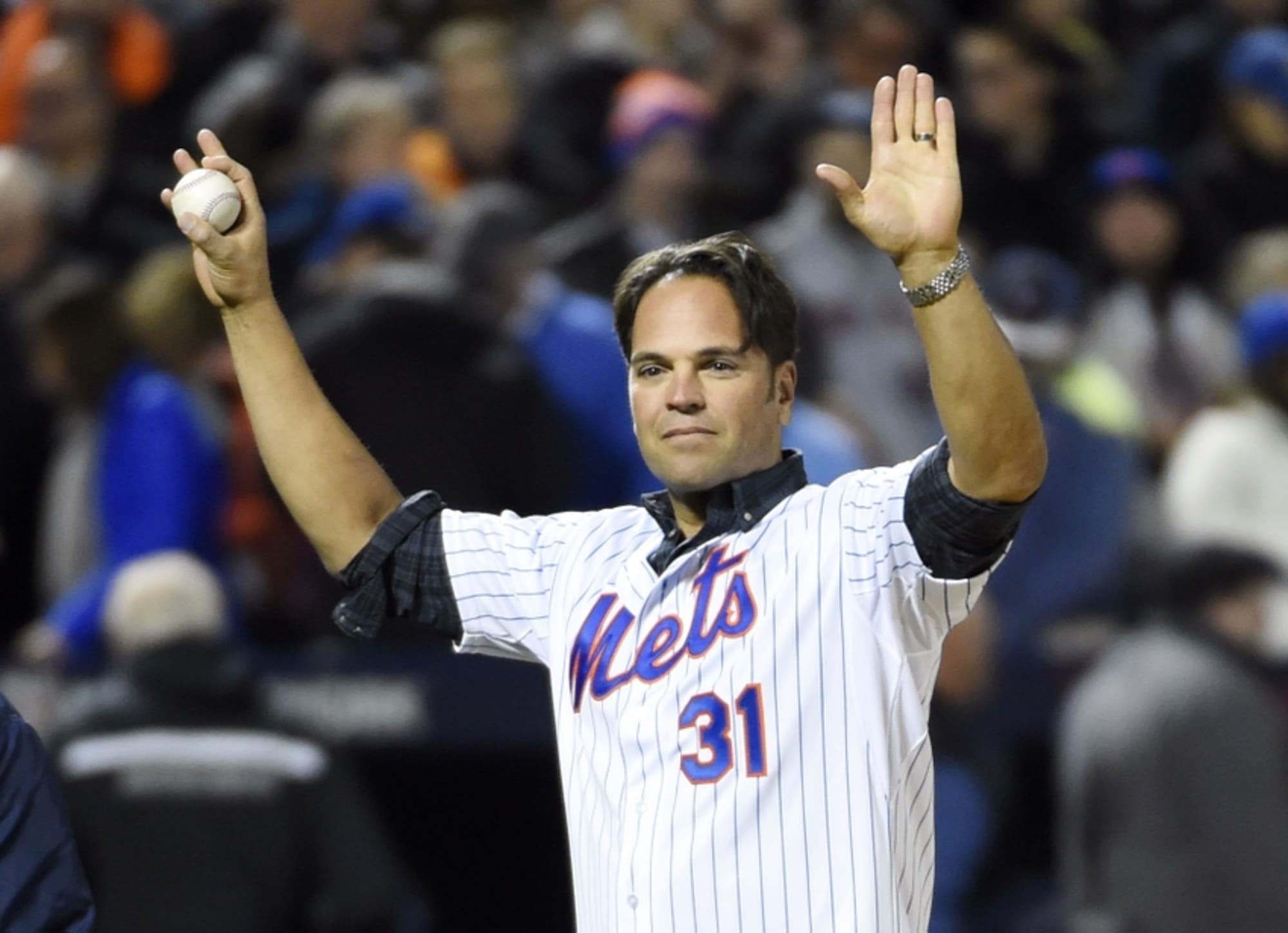 New York Mets' catcher Mike Piazza appears on the ground before a