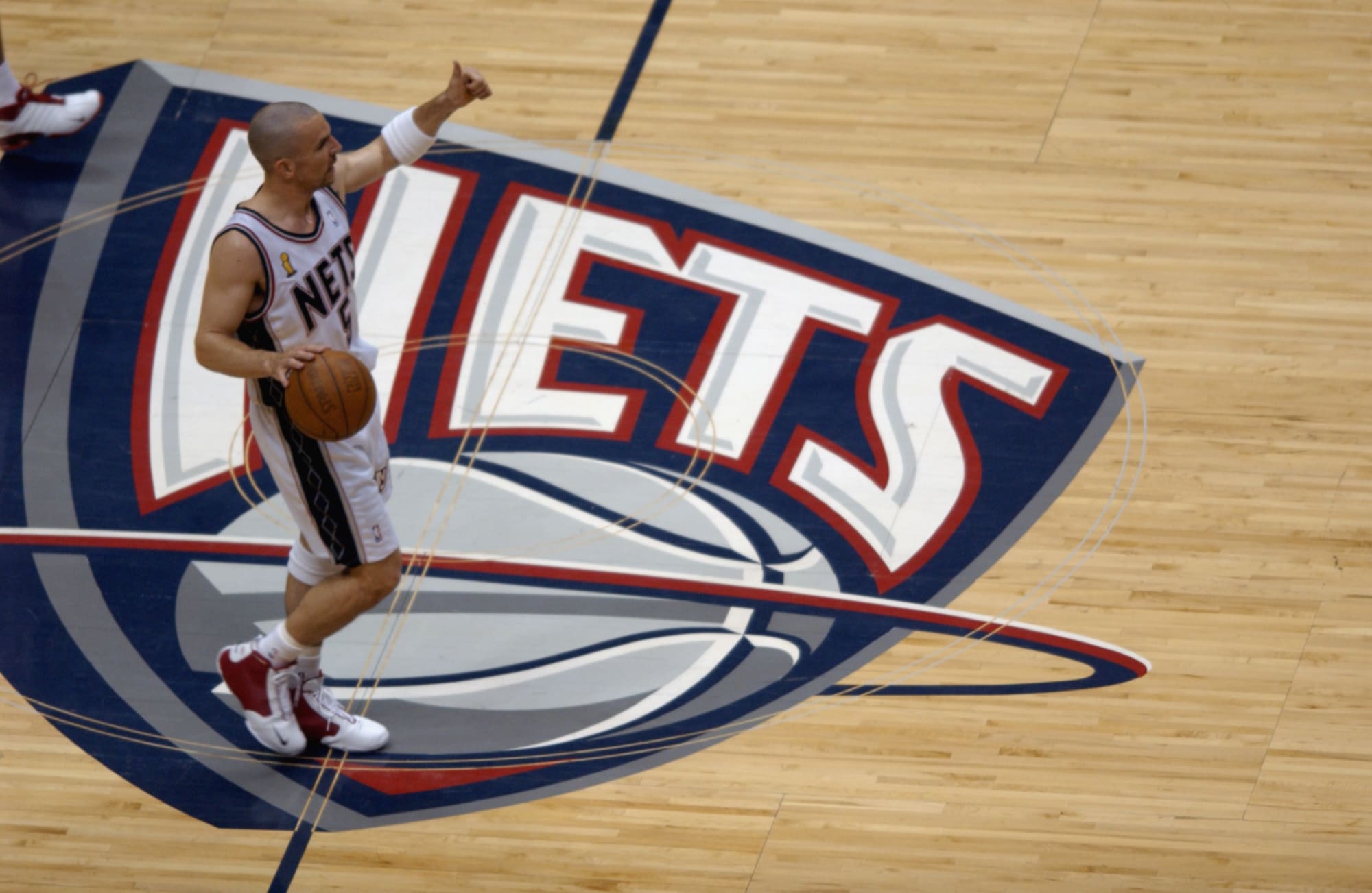 Guard Jason Kidd of the New Jersey Nets points down court during