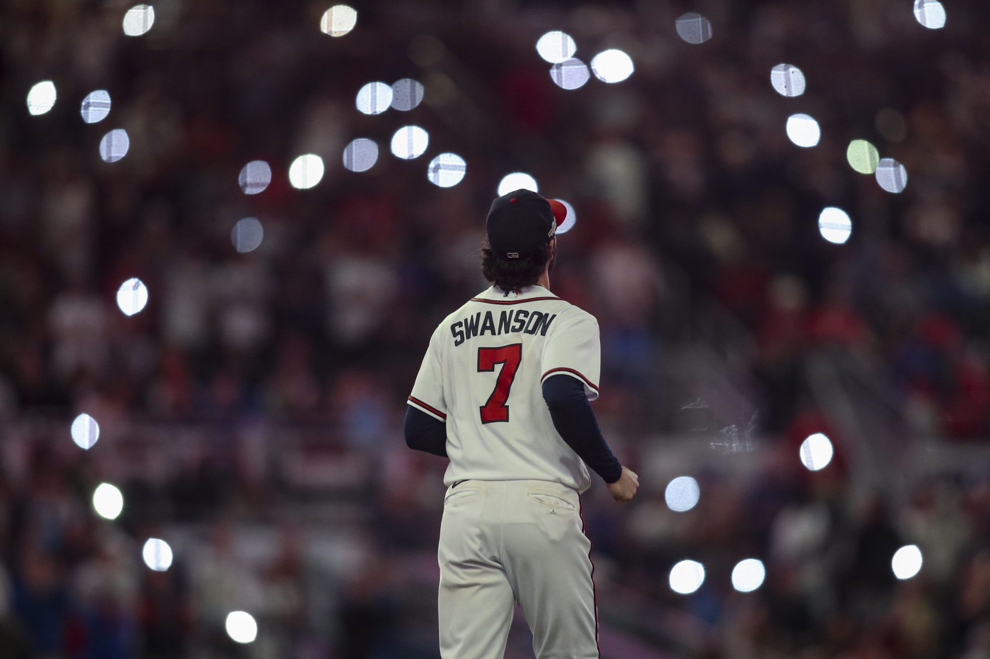 Chicago Cubs' Dansby Swanson watches the flight of the ball during