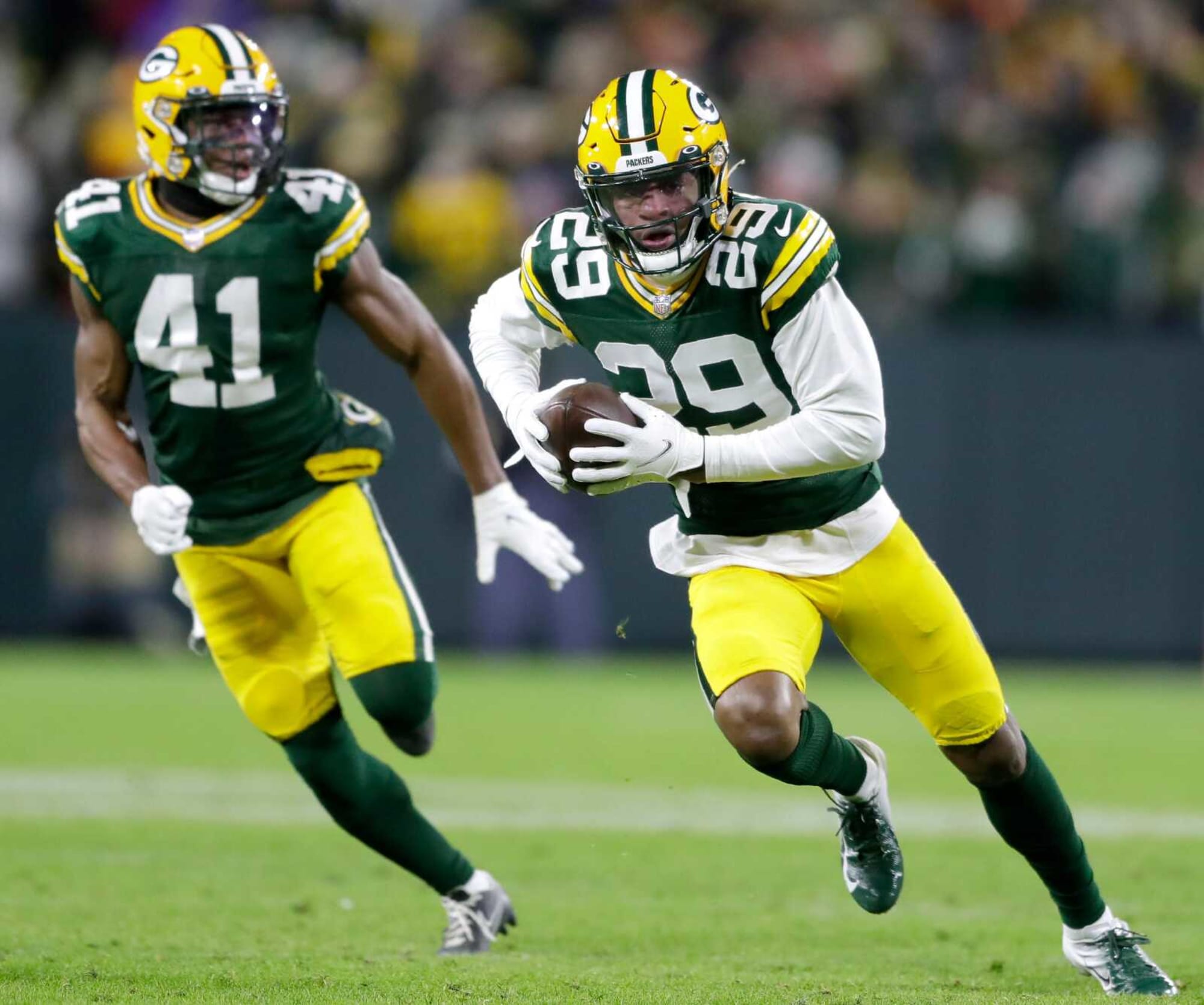 Rasul Douglas runs with one of his five intercepted passes with the Packers