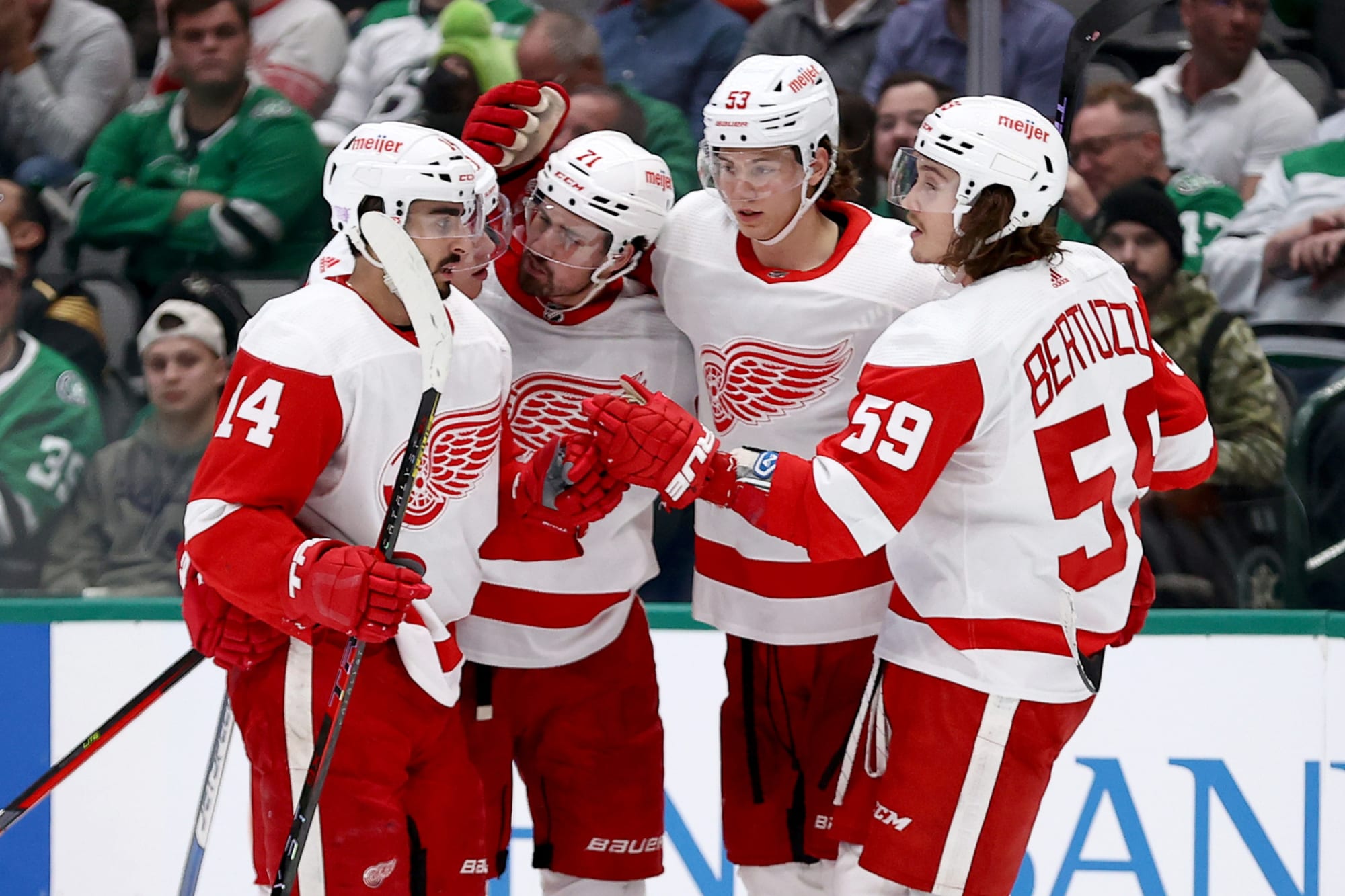 Detroit Red Wings left wing Lucas Raymond (23) celebrates with left wing  Tyler Bertuzzi (59) af …