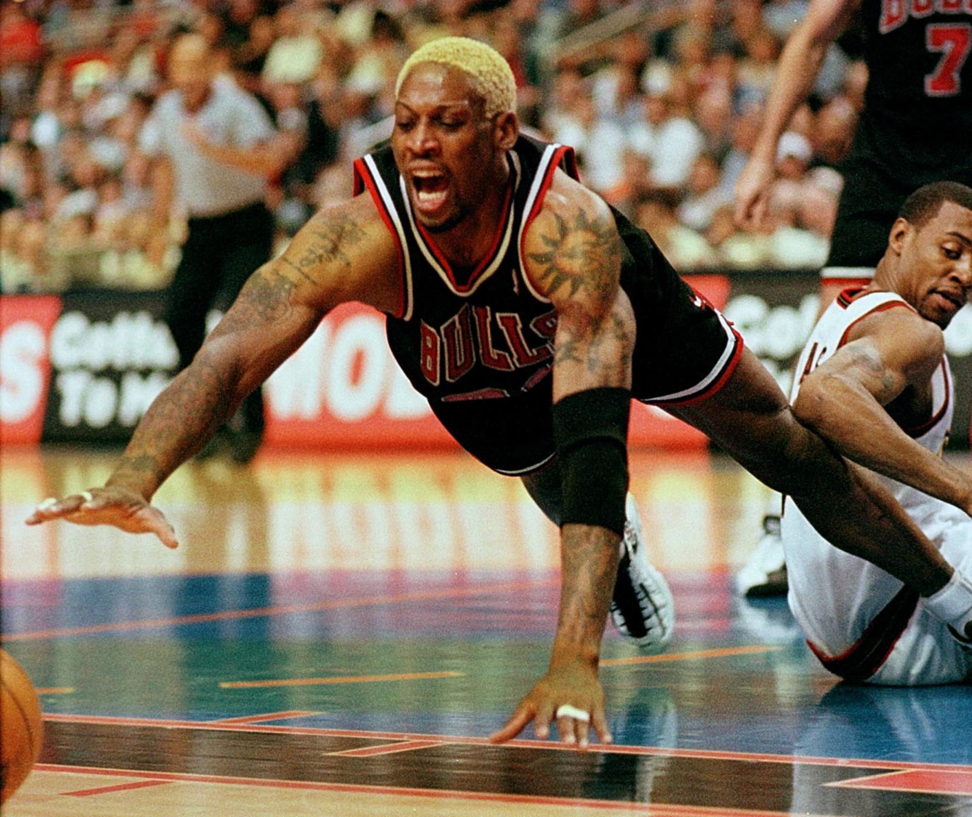 Dennis Rodman of the Los Angeles Lakers looks on against the