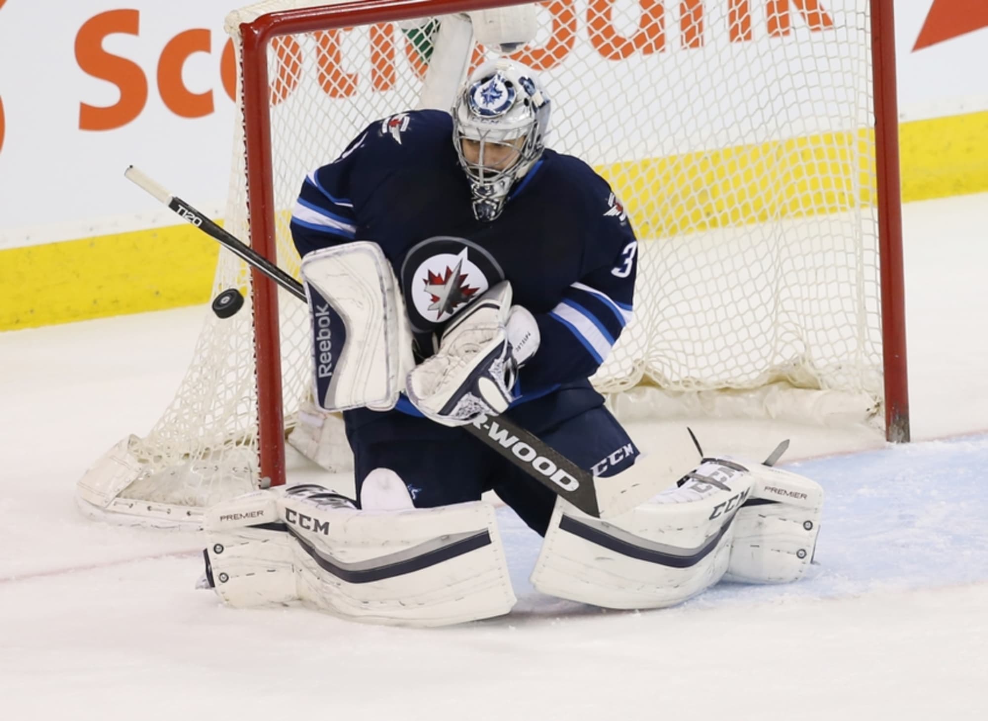 Winnipeg Jets goaltender Ondrej Pavelec (31) is hit in the mask by