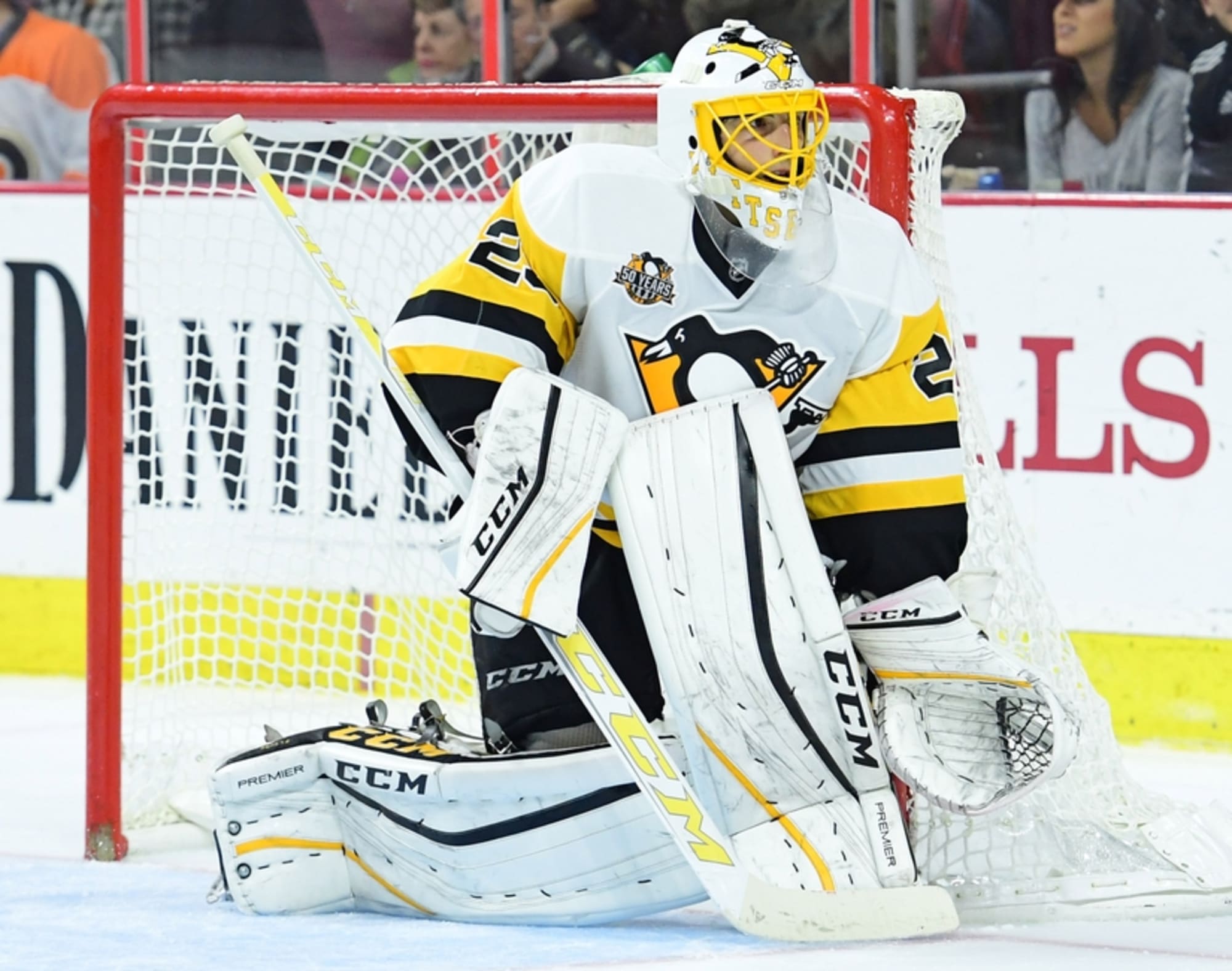 Pittsburgh Penguins goalie Marc-Andre Fleury (29) covers the puck in first  period of the Flames 4-2 win against the Pittsburgh Penguins at the Consol  Energy Center in Pittsburgh on March 5, 2016.