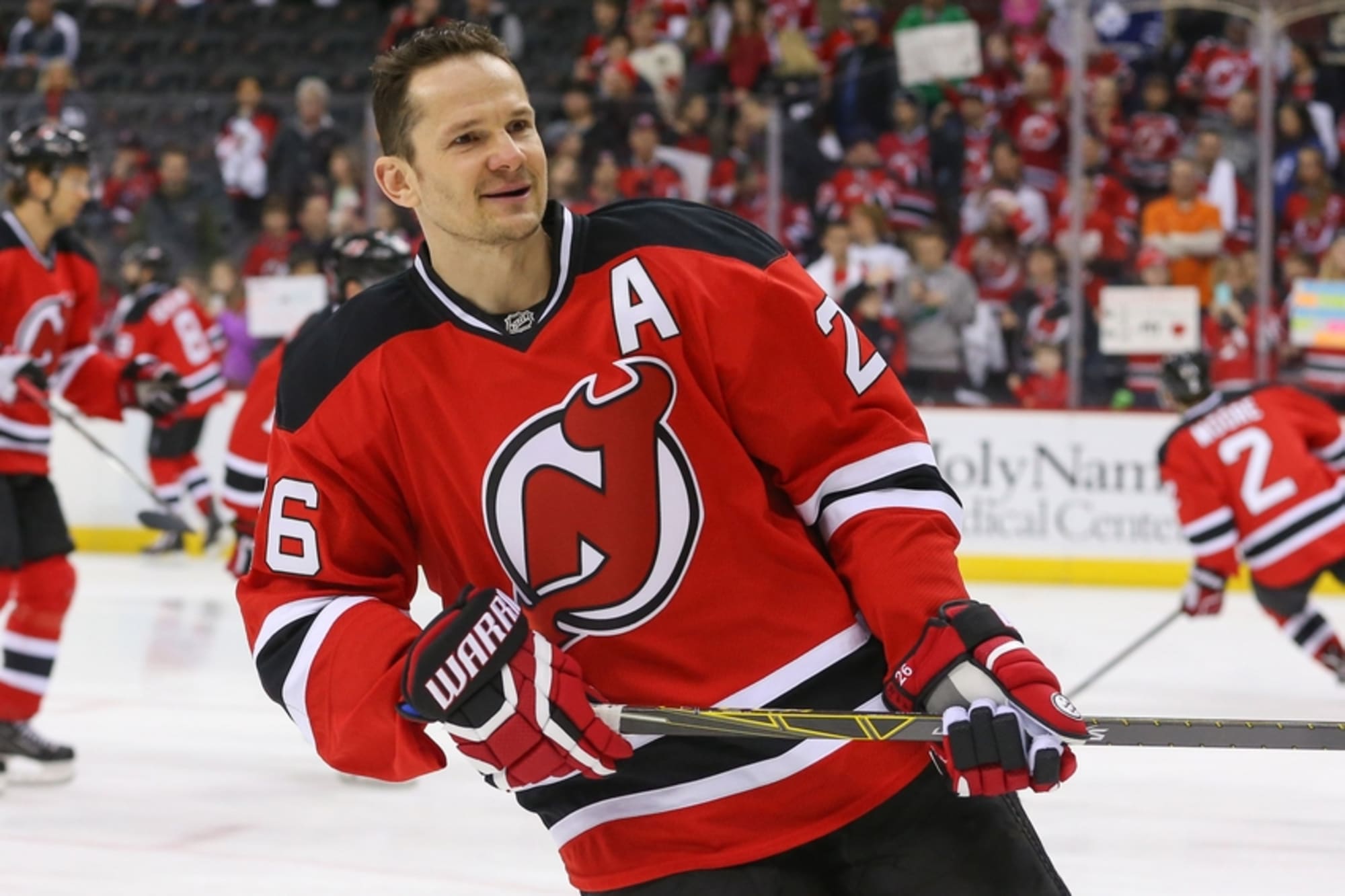 New Jersey Devils' Patrik Elias (26) kisses his daughter Kaila during  warmups prior to an NHL hockey game against the New York Islanders,  Saturday, April 8, 2017, in Newark, N.J. The Devils