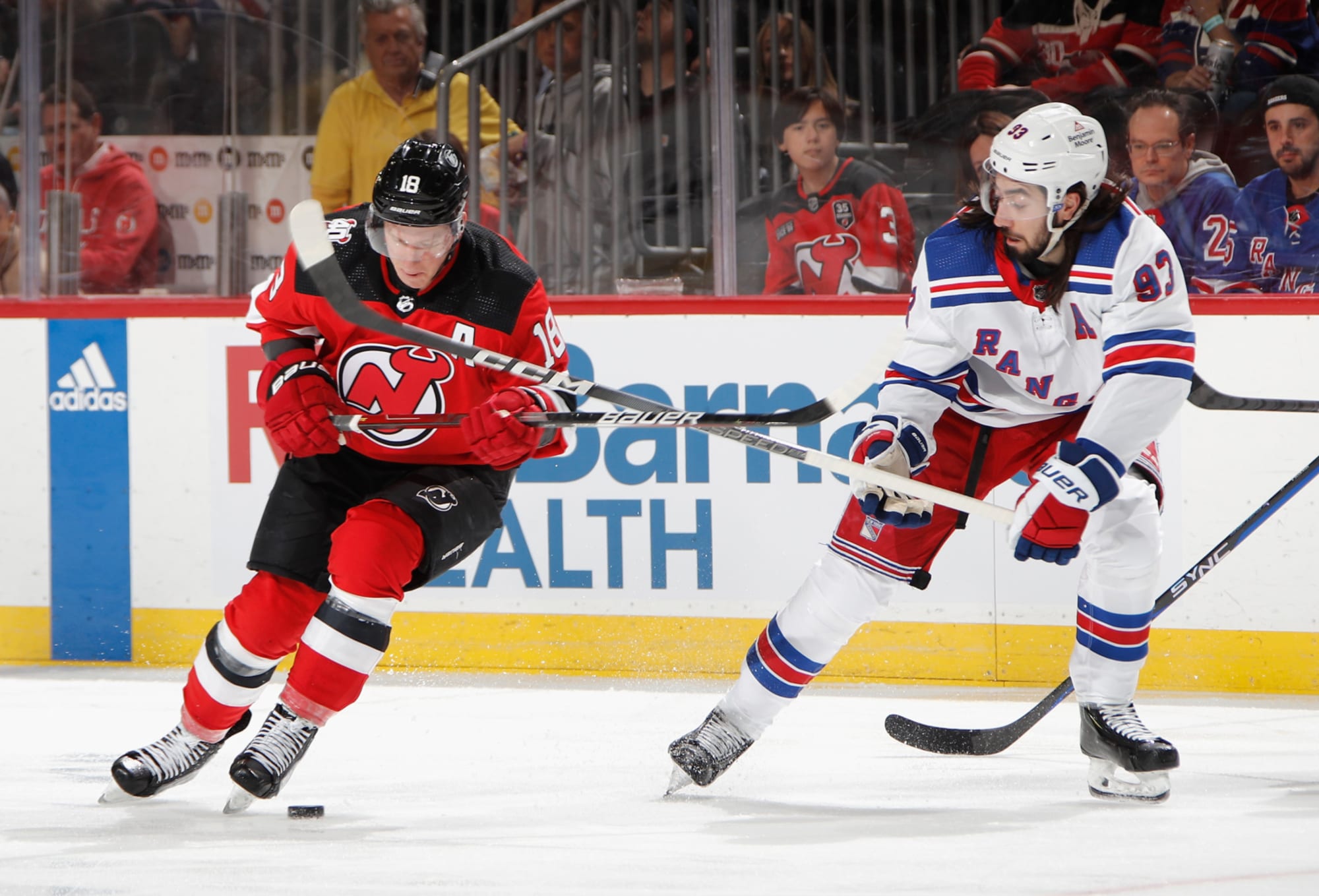 Jack Hughes of the New Jersey Devils and Chris Kreider of the New News  Photo - Getty Images