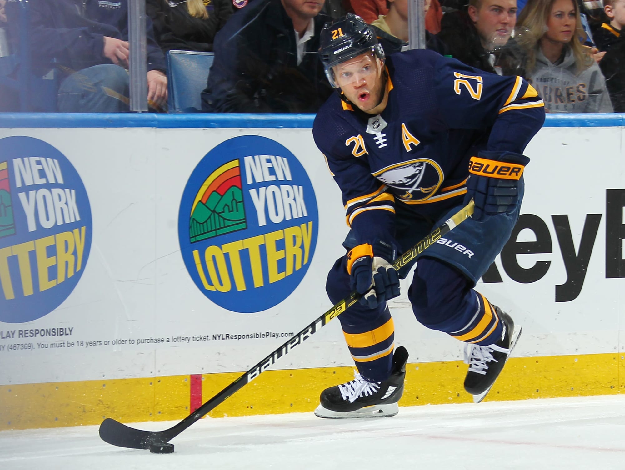 Buffalo Sabres forward Kyle Okposo (21) passes the puck during the first  period of an NHL