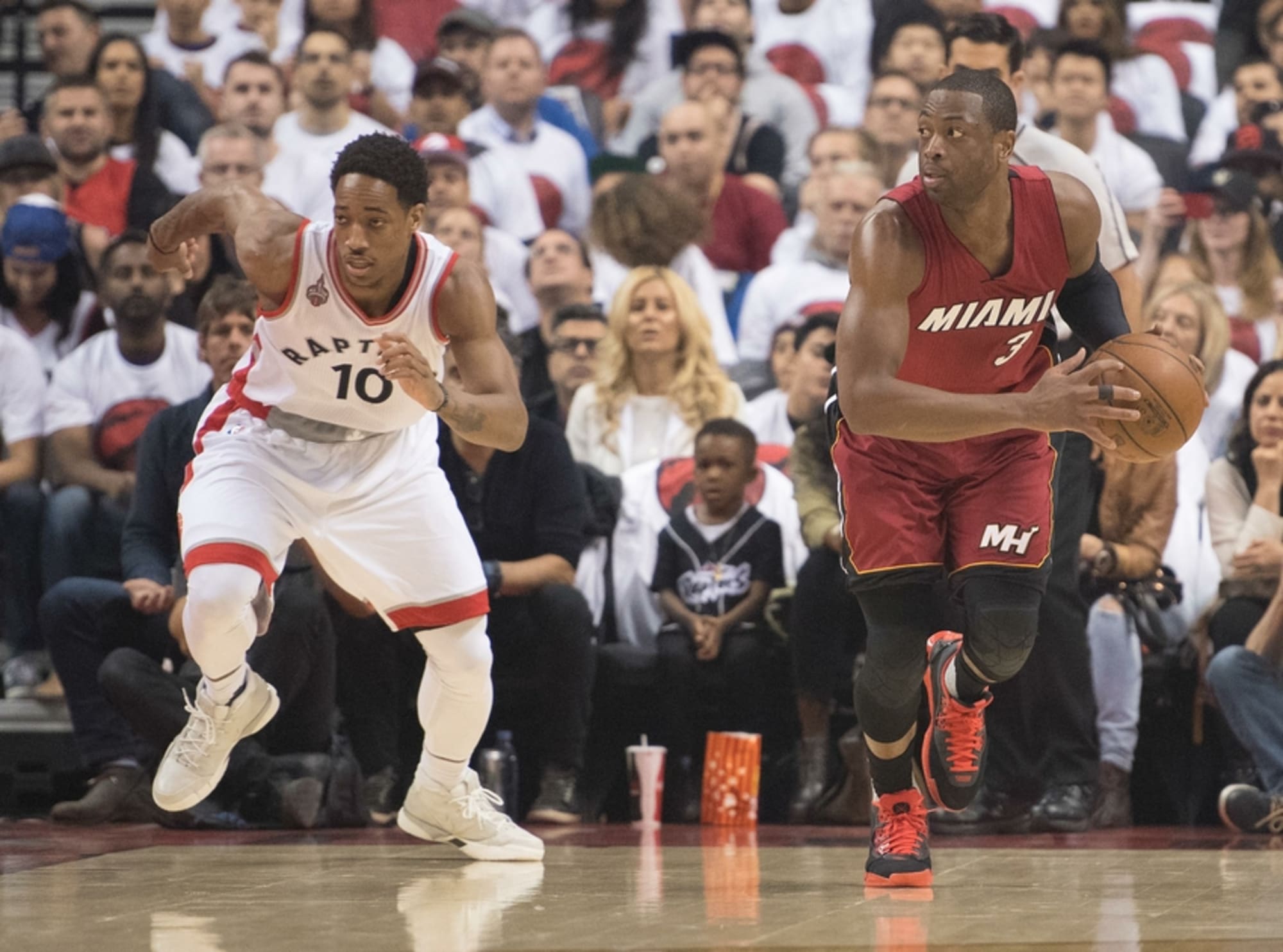Toronto Raptors' DeMar DeRozan (10) gets fouled by Minnesota Timberwolves'  Andrew Wiggins (22) during the first