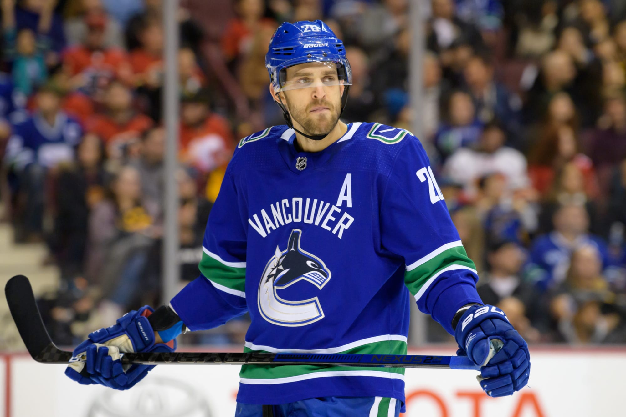 Which players who have played for both Vancouver Canucks and