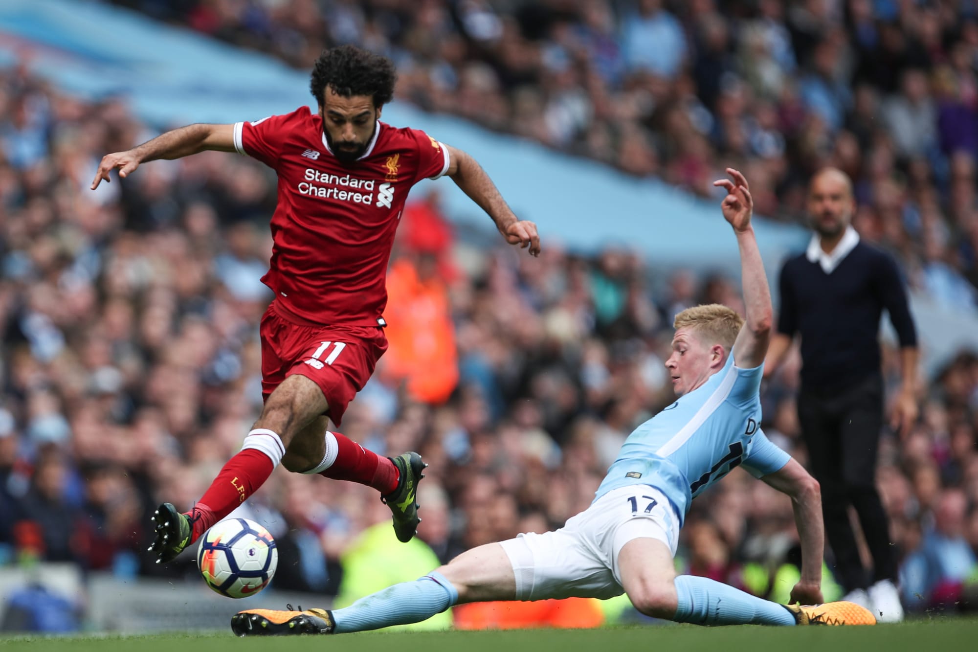 Mohamed Salah and Kevin de Bruyne playing for Liverpool and Manchester City respectively.