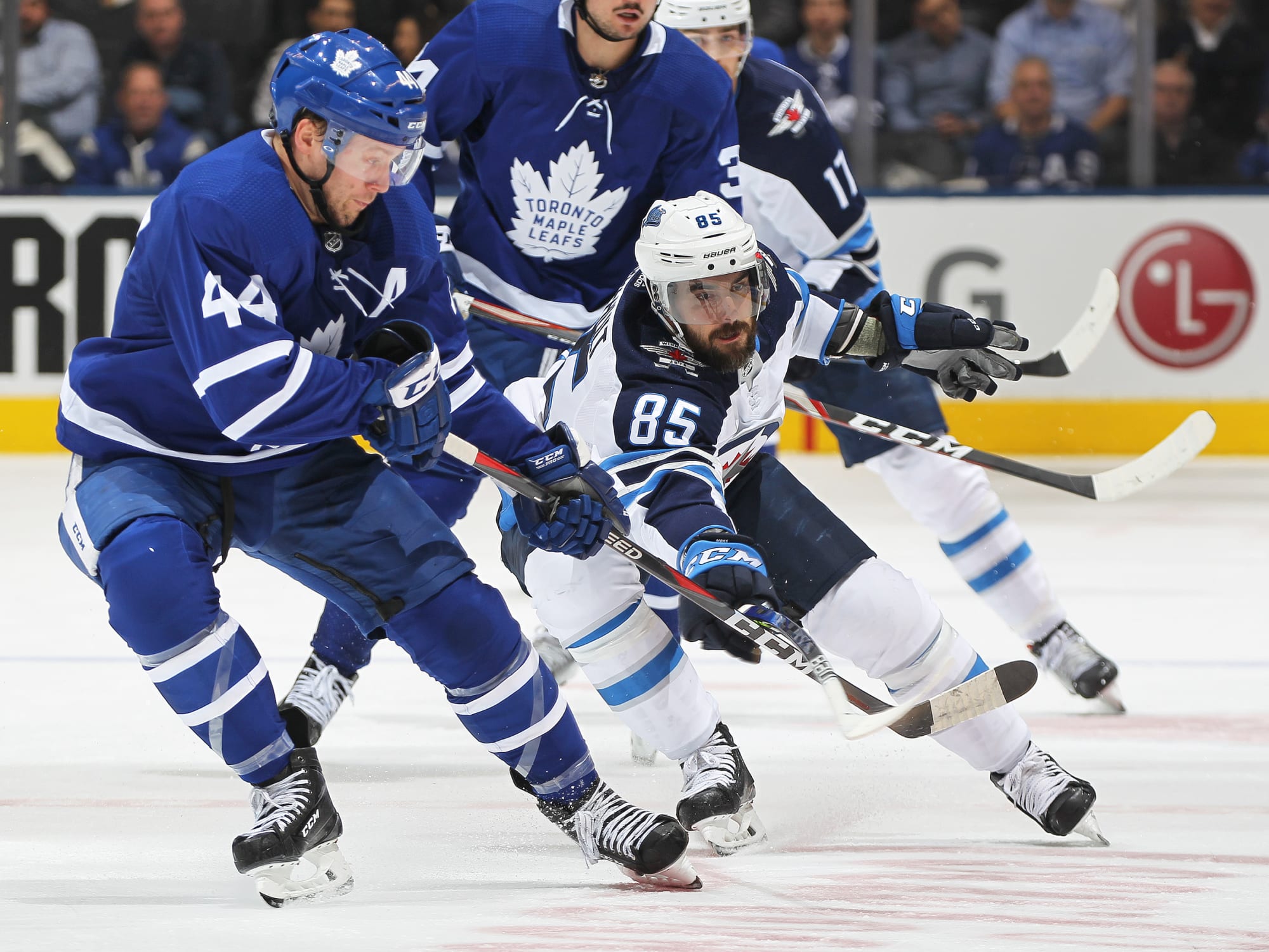 Toronto Maple Leafs defenceman Morgan Rielly (44) battles for the