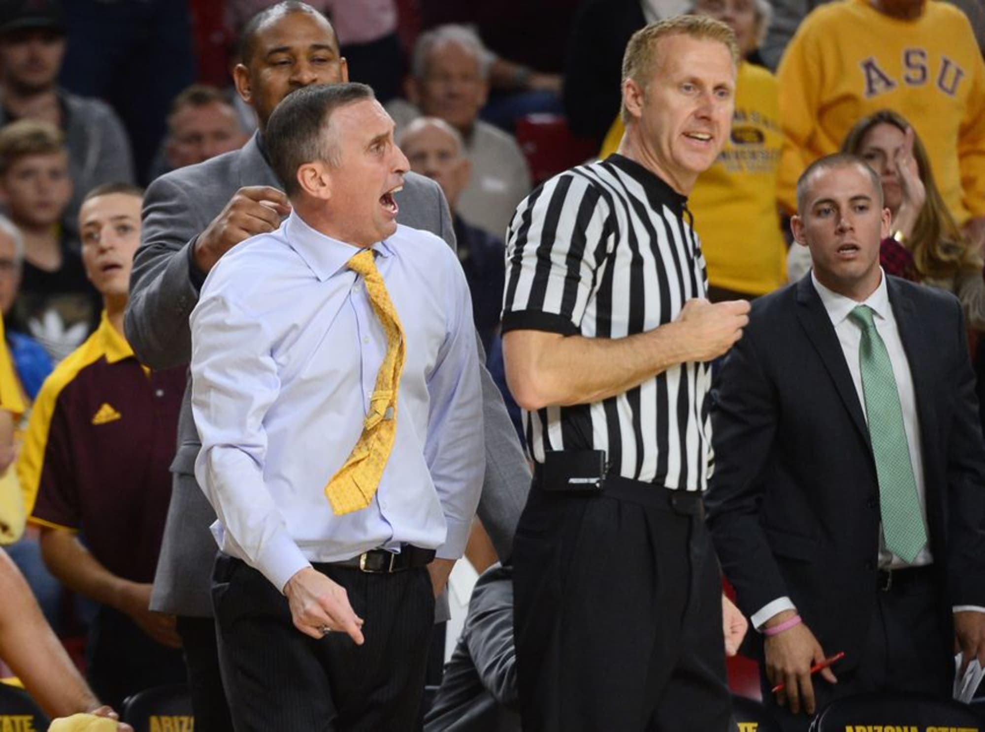 Arizona State University head coach Bobby Hurley gets hurled by referee