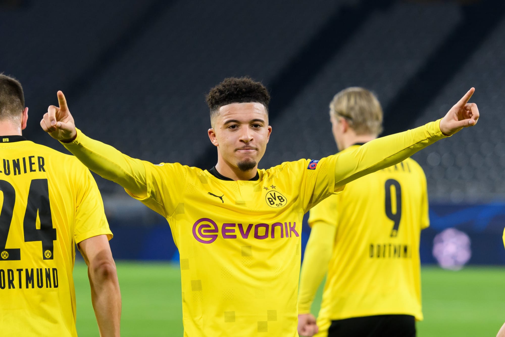  Jadon Sancho celebrates after dribbling past PSG players in the Champions League.