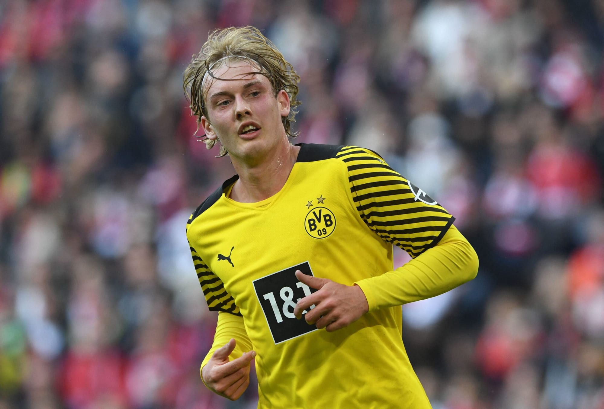  Julian Brandt, a midfielder for Borussia Dortmund, is shown in action during a match.