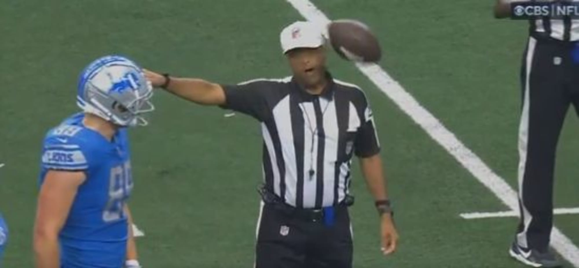 NFL ref gets hit in the head while announcing penalty