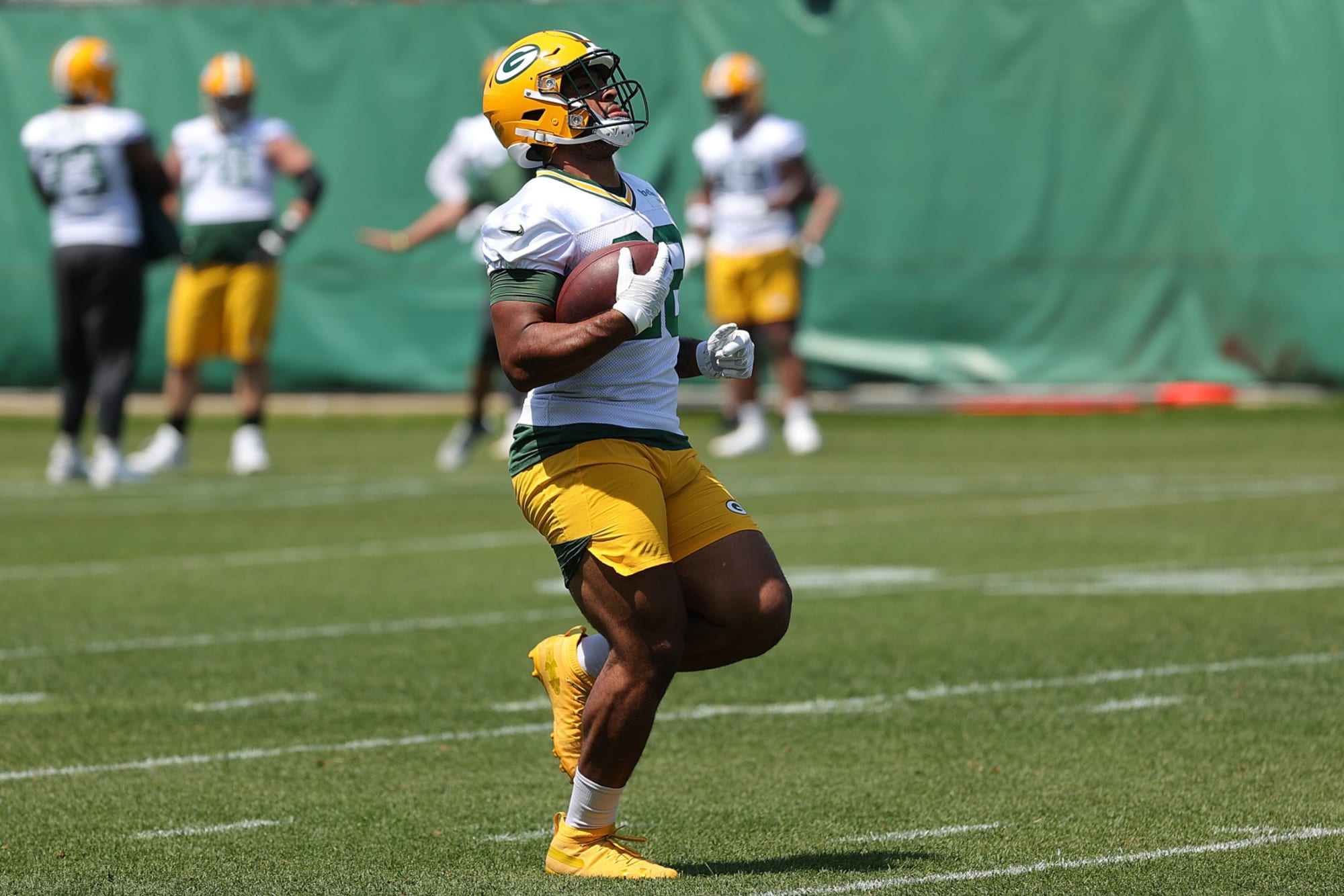 Photo of Packers minicamp photos prove A.J. Dillon stole the ‘Quad King’ title from Saquon Barkley