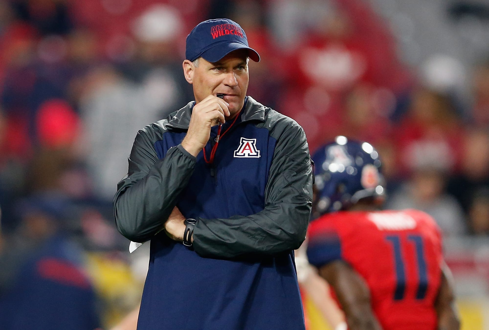 Arizona Football Coach Rodriguez doesn't rule out playing 23 QBs