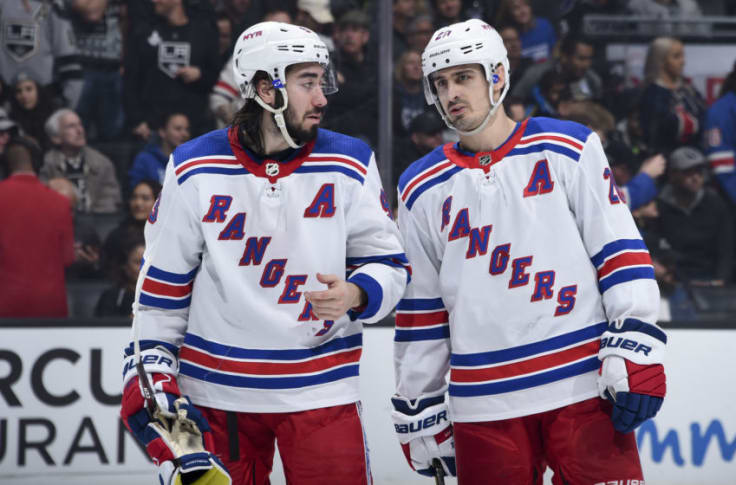 New York Rangers' Chris Kreider (20) celebrates his goal with teammate Mika  Zibanejad (93) against the Carolina Hurricanes during the second period of  an NHL hockey game in Raleigh, N.C., Sunday, March